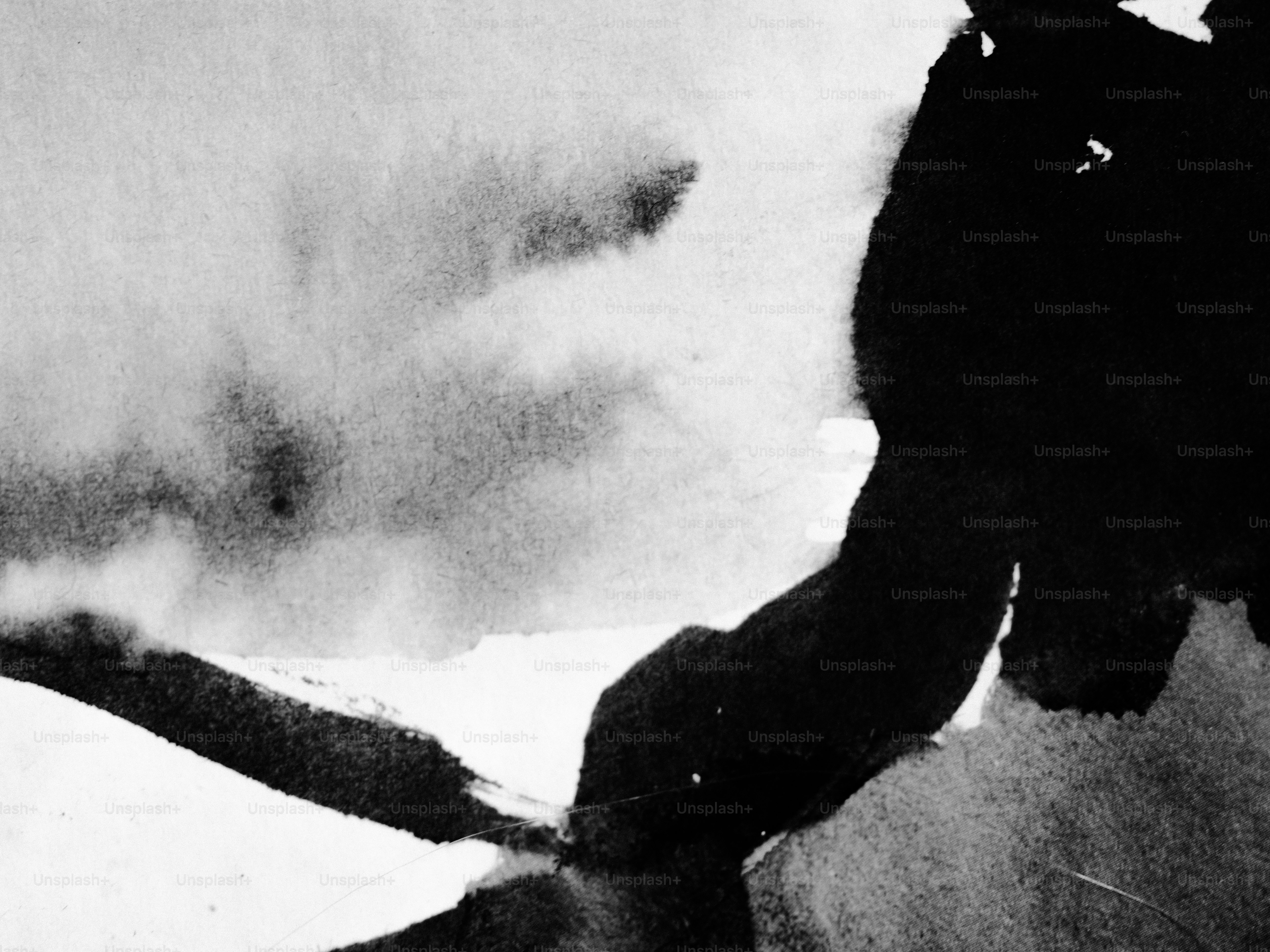 An explosion with smoke in black and white.