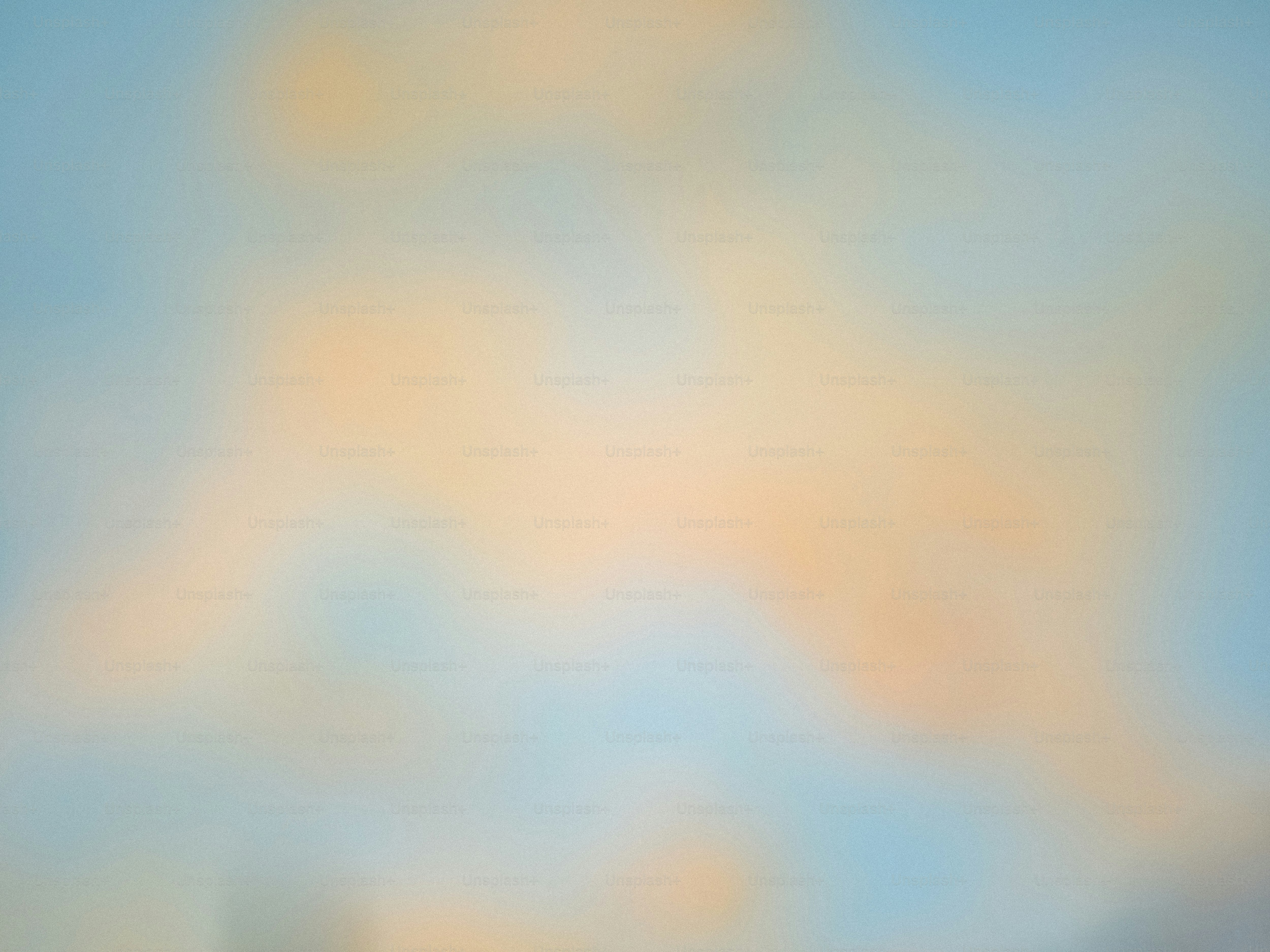 Soft, blurred colors create a gentle abstract background.