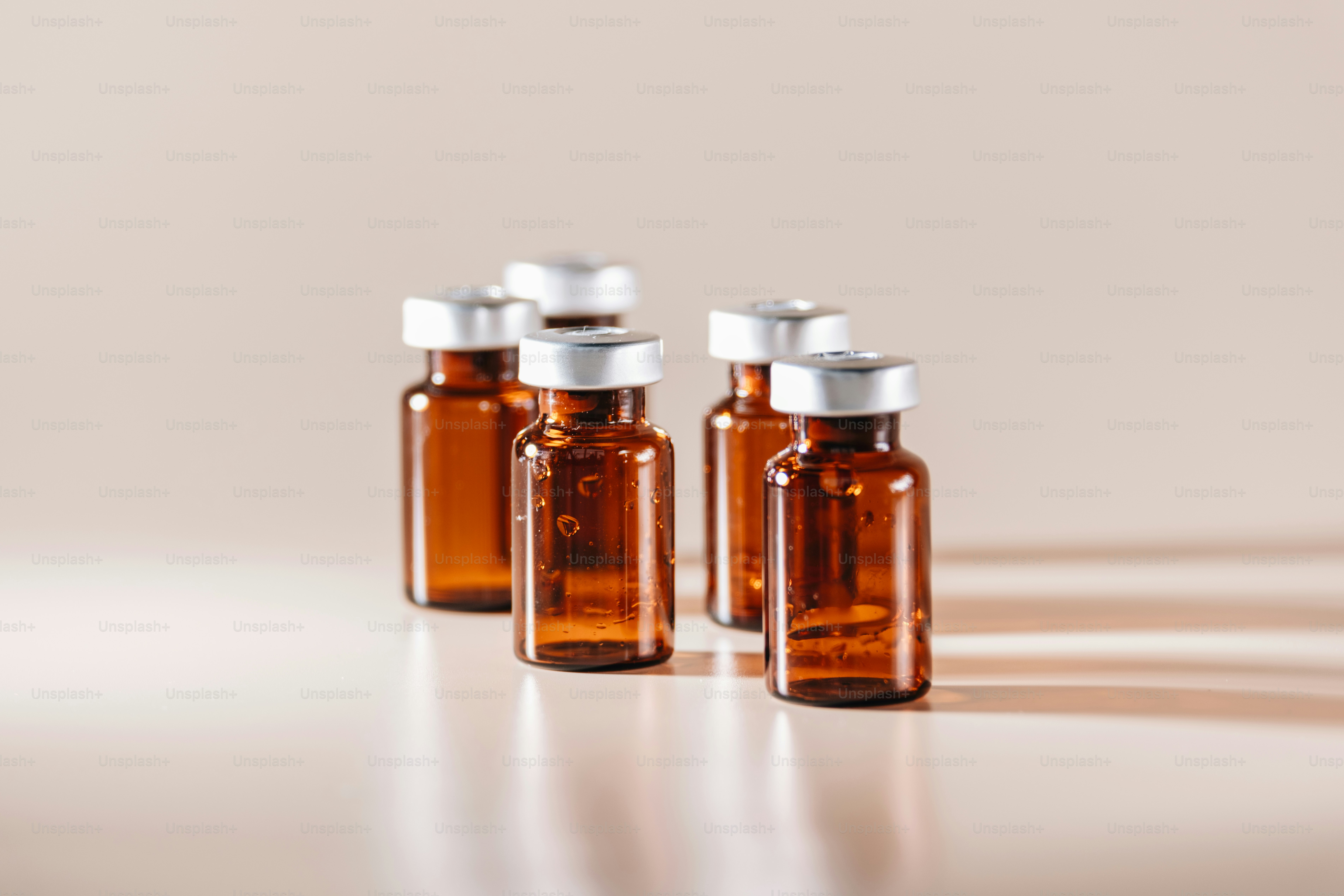 Several vials with medication are in a group