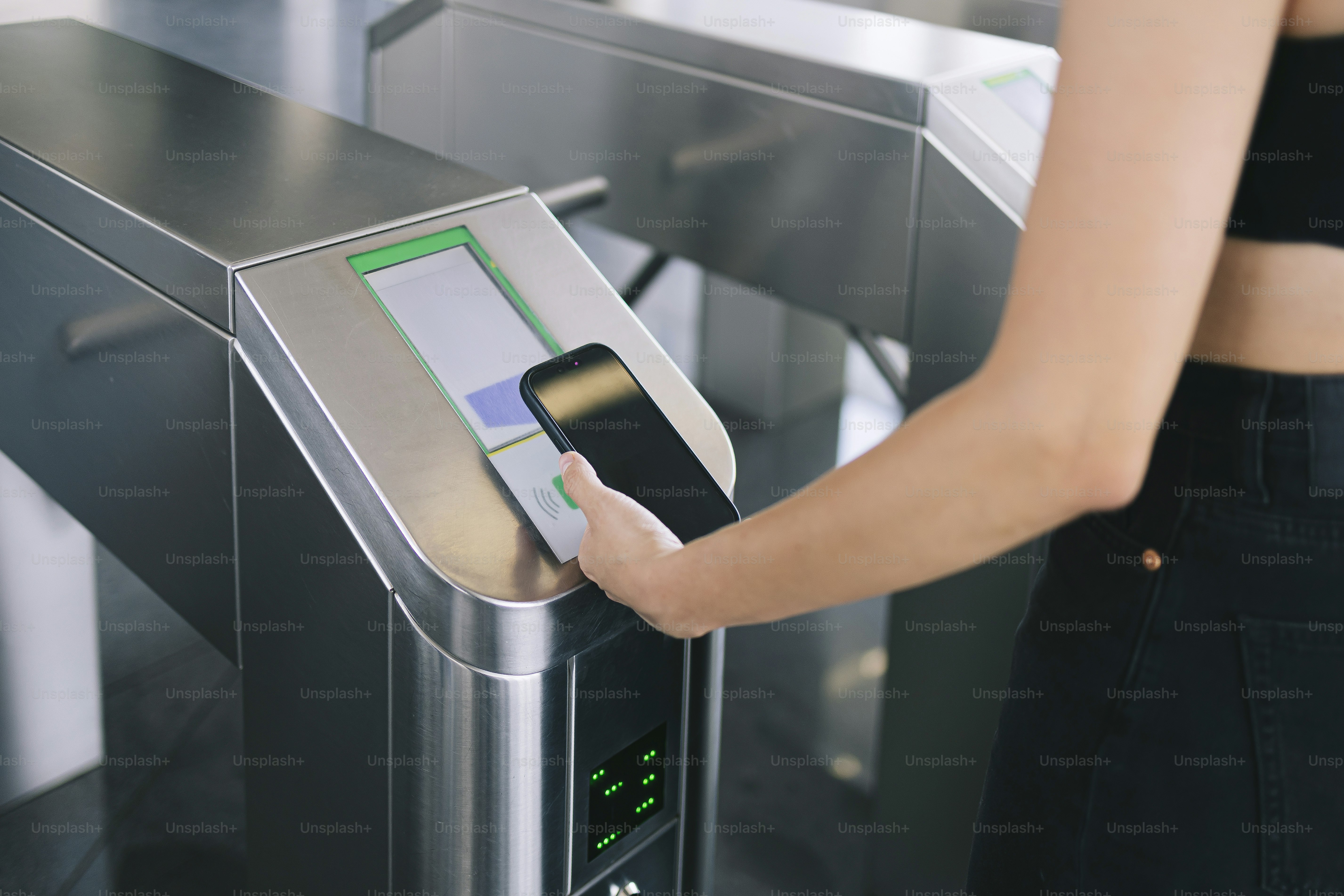 Woman uses phone to scan an access point. photo – Money Image on Unsplash