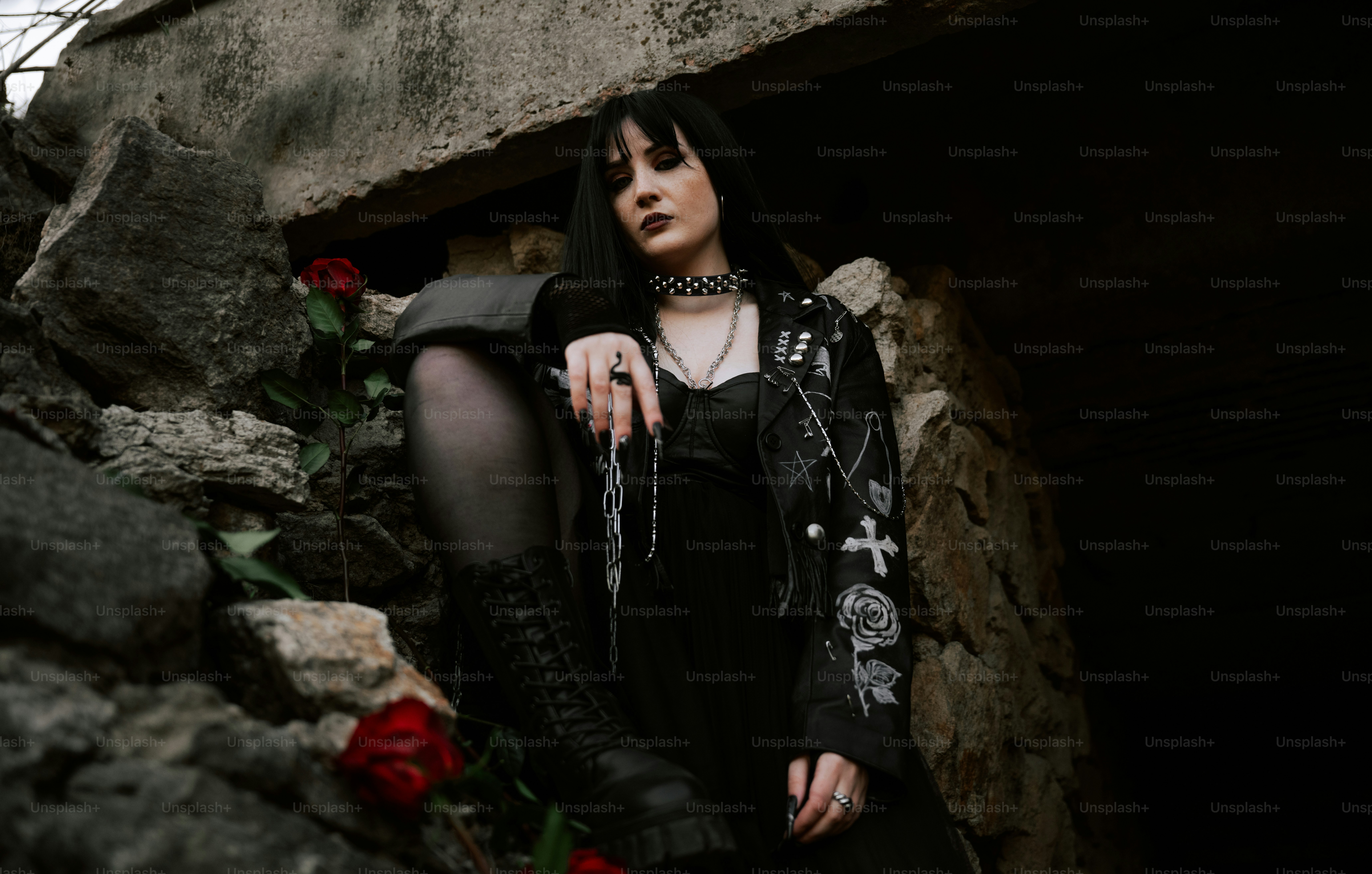 Goth woman with roses and a dark aesthetic.