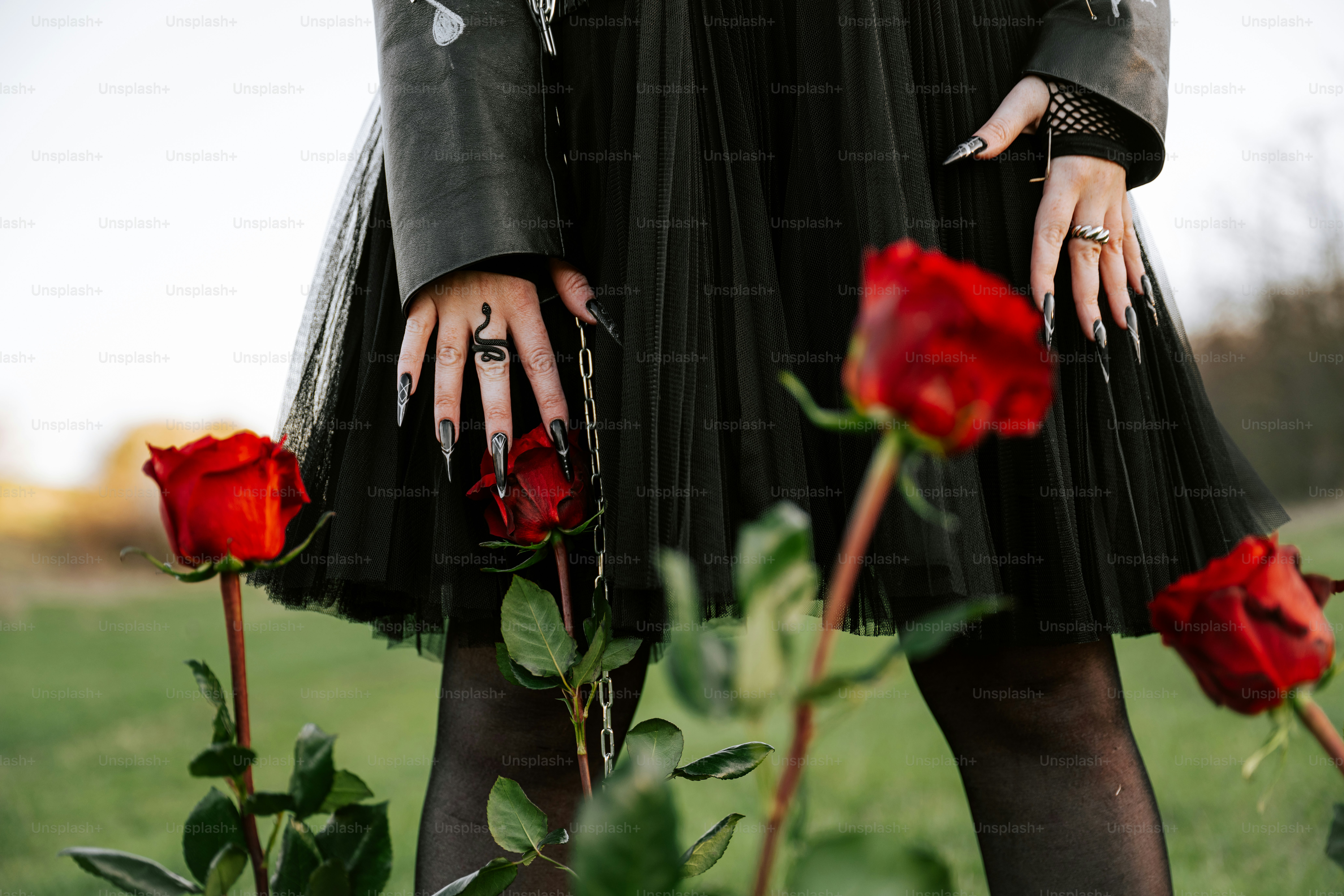 Woman with long nails and red roses.