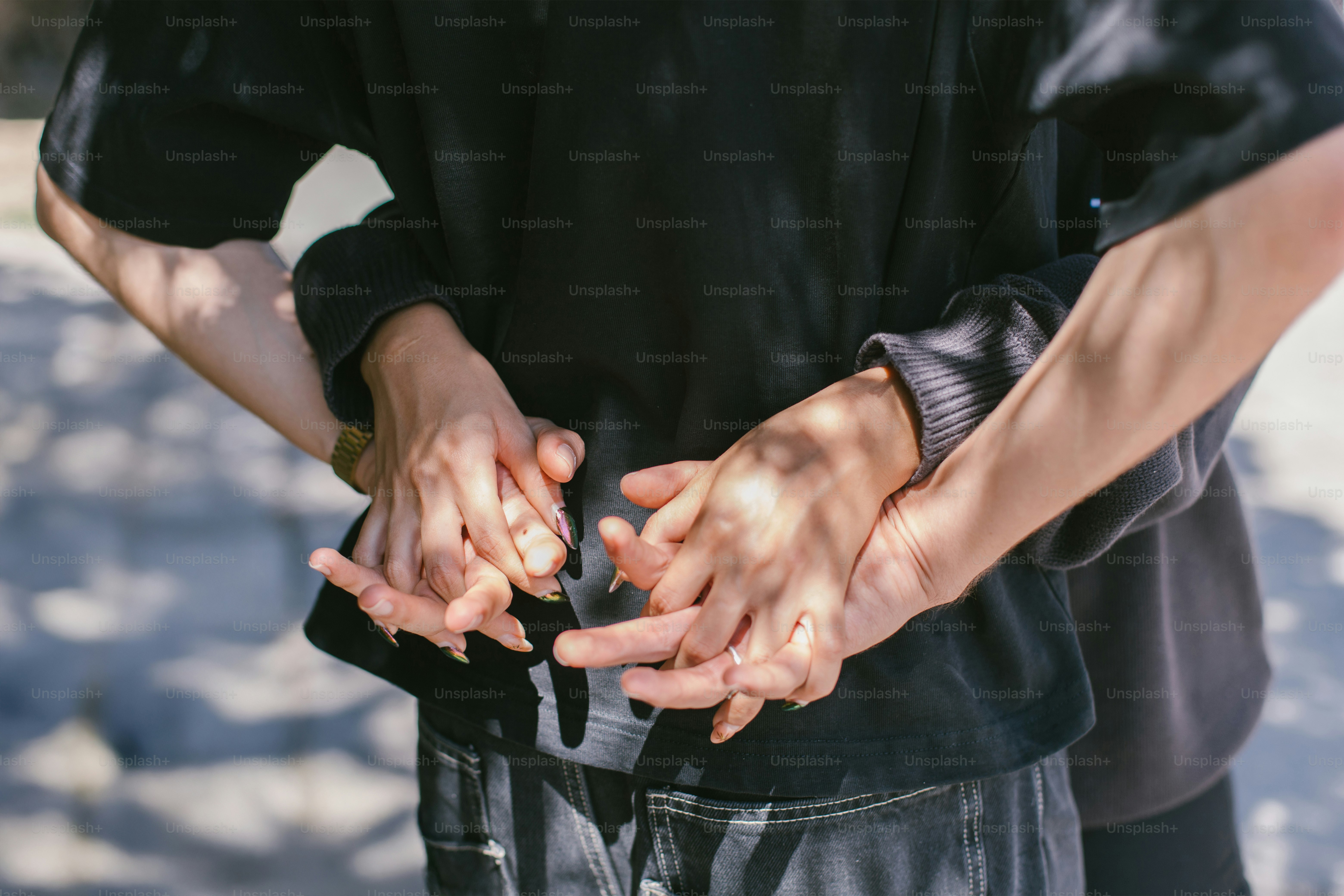 Hands embrace in a tender hug.