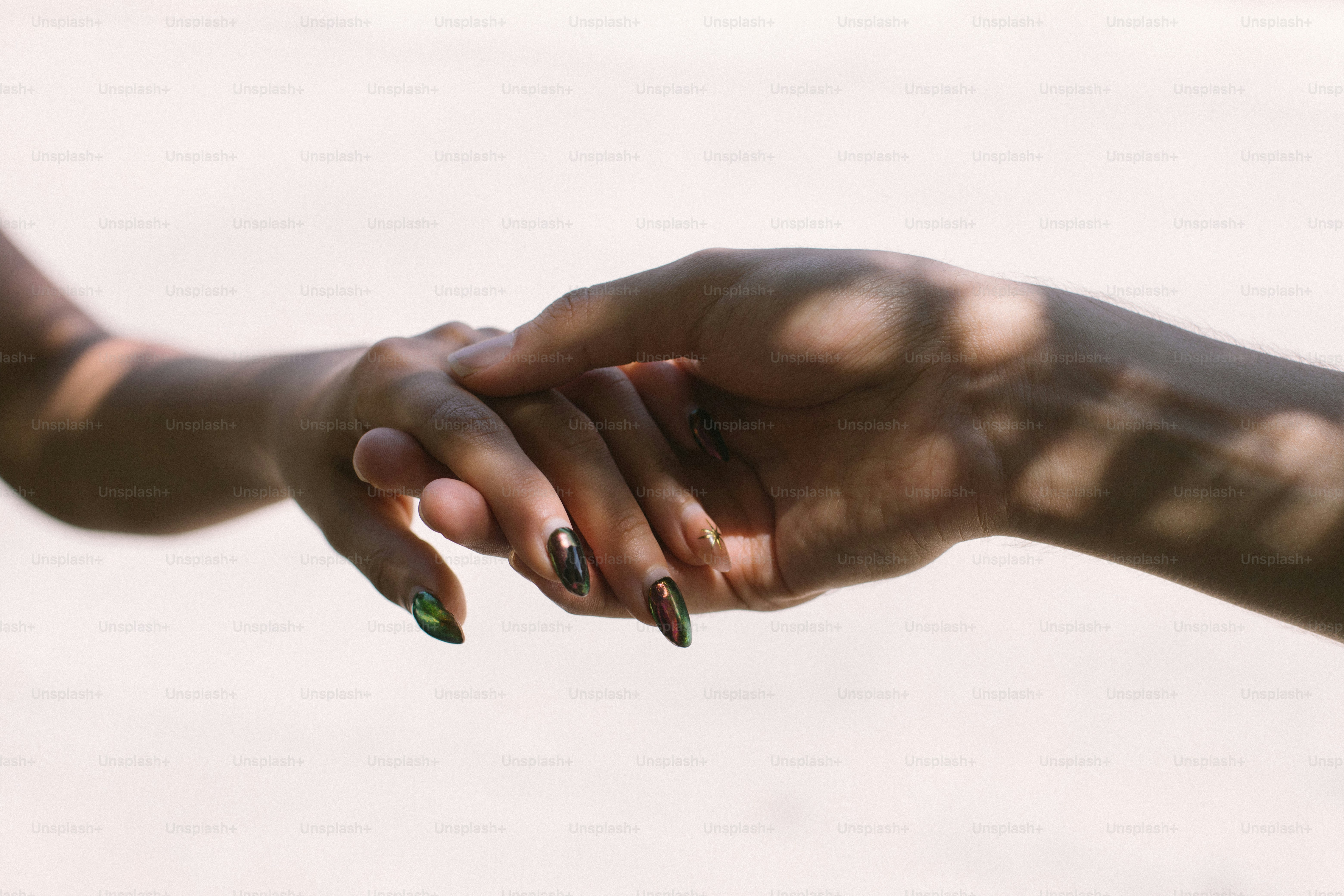 People are joining hands in a sign of unity. photo – Green Image on ...