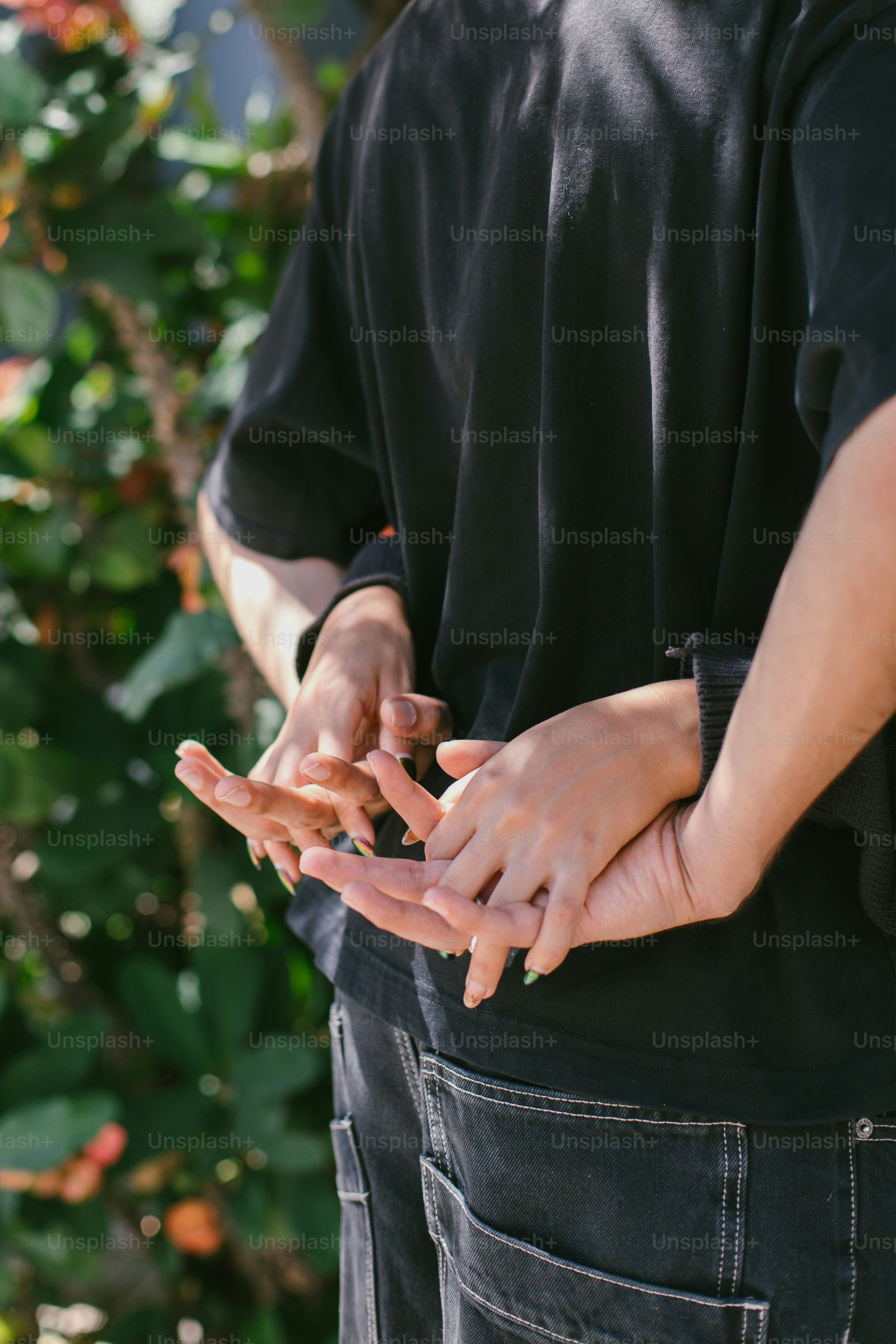 Hands gently embracing each other.