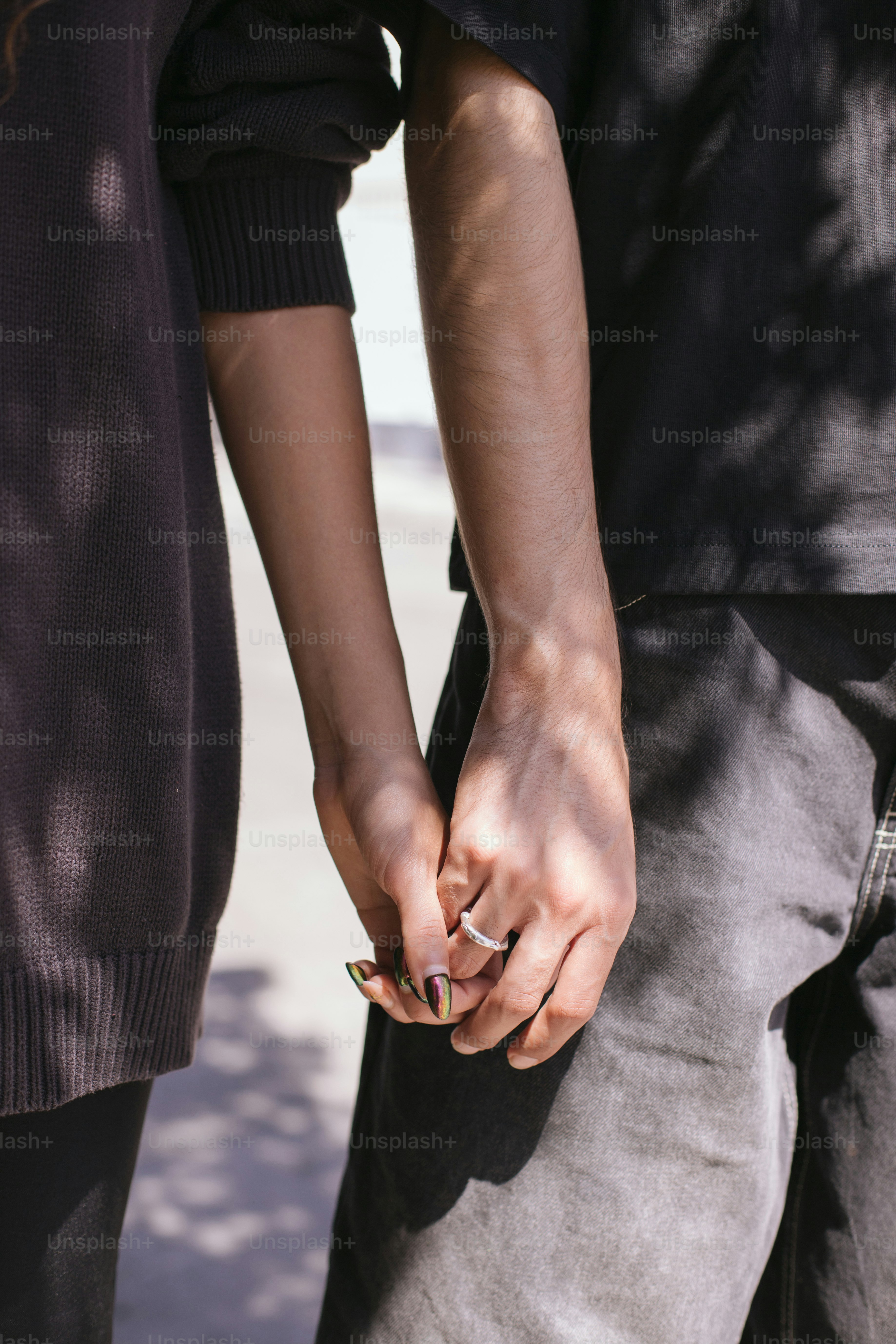 Couple holds hands, showing affection and love. photo – Hands Image on ...