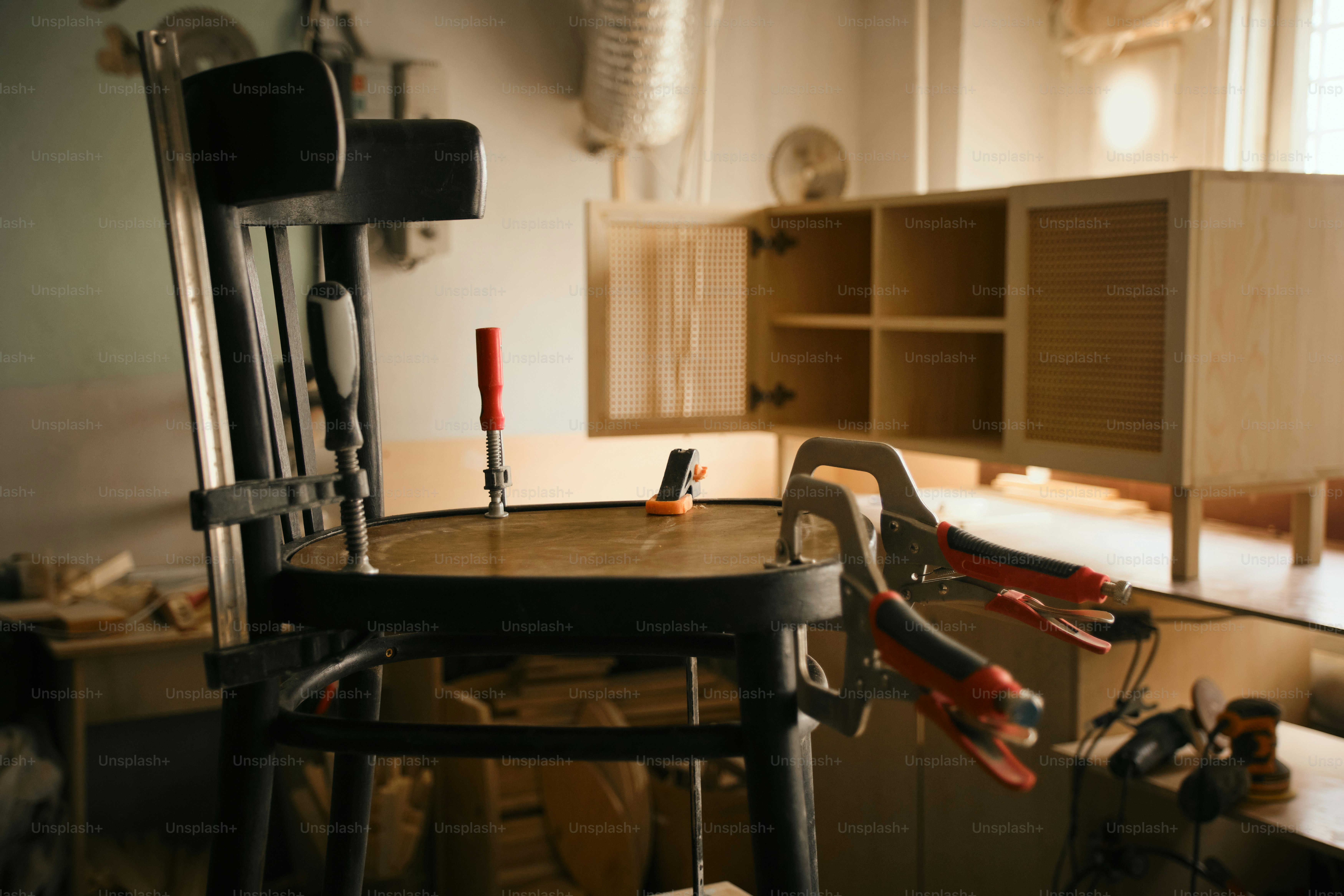 Furniture assembly in a woodworking workshop.