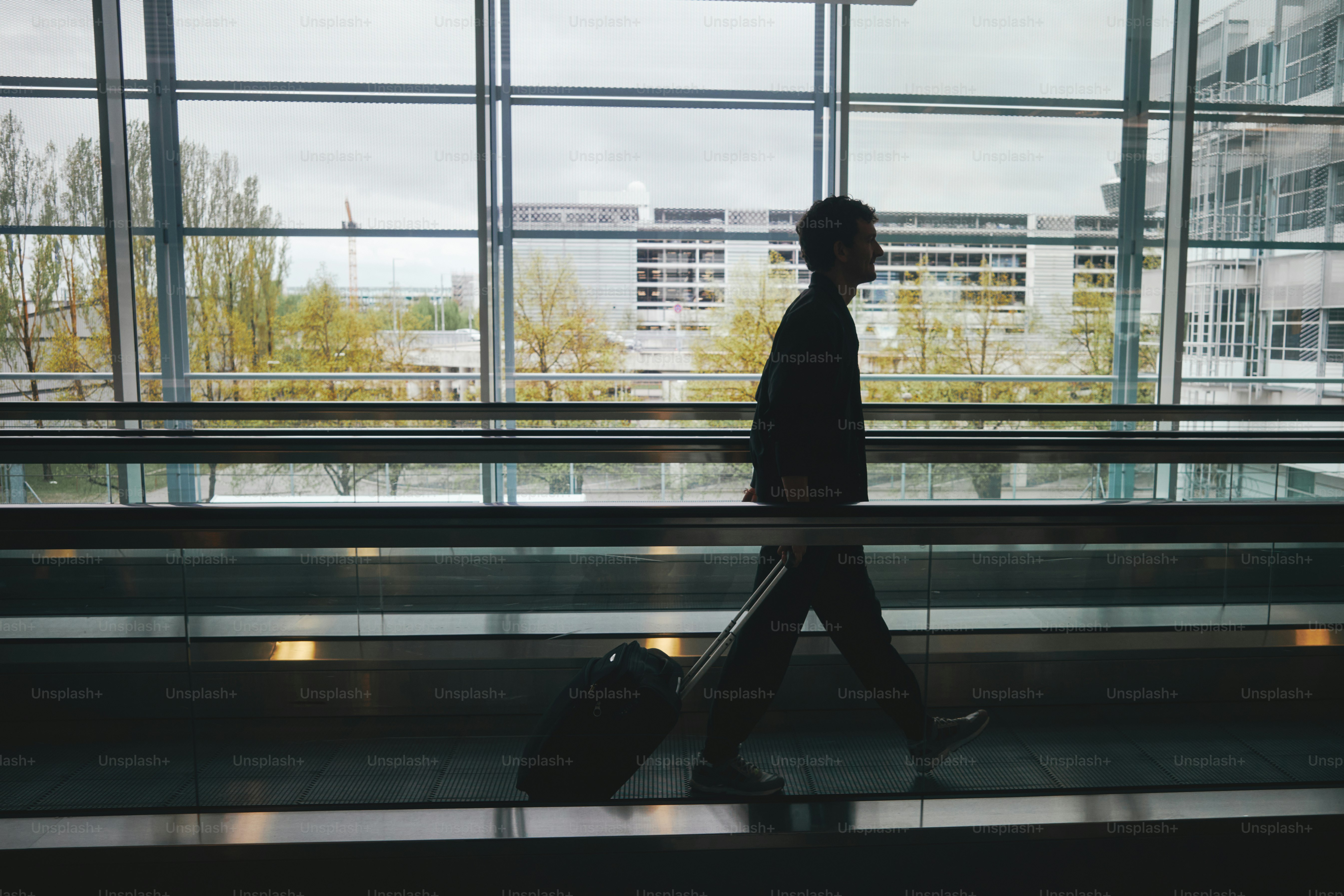 A person walks through an airport.