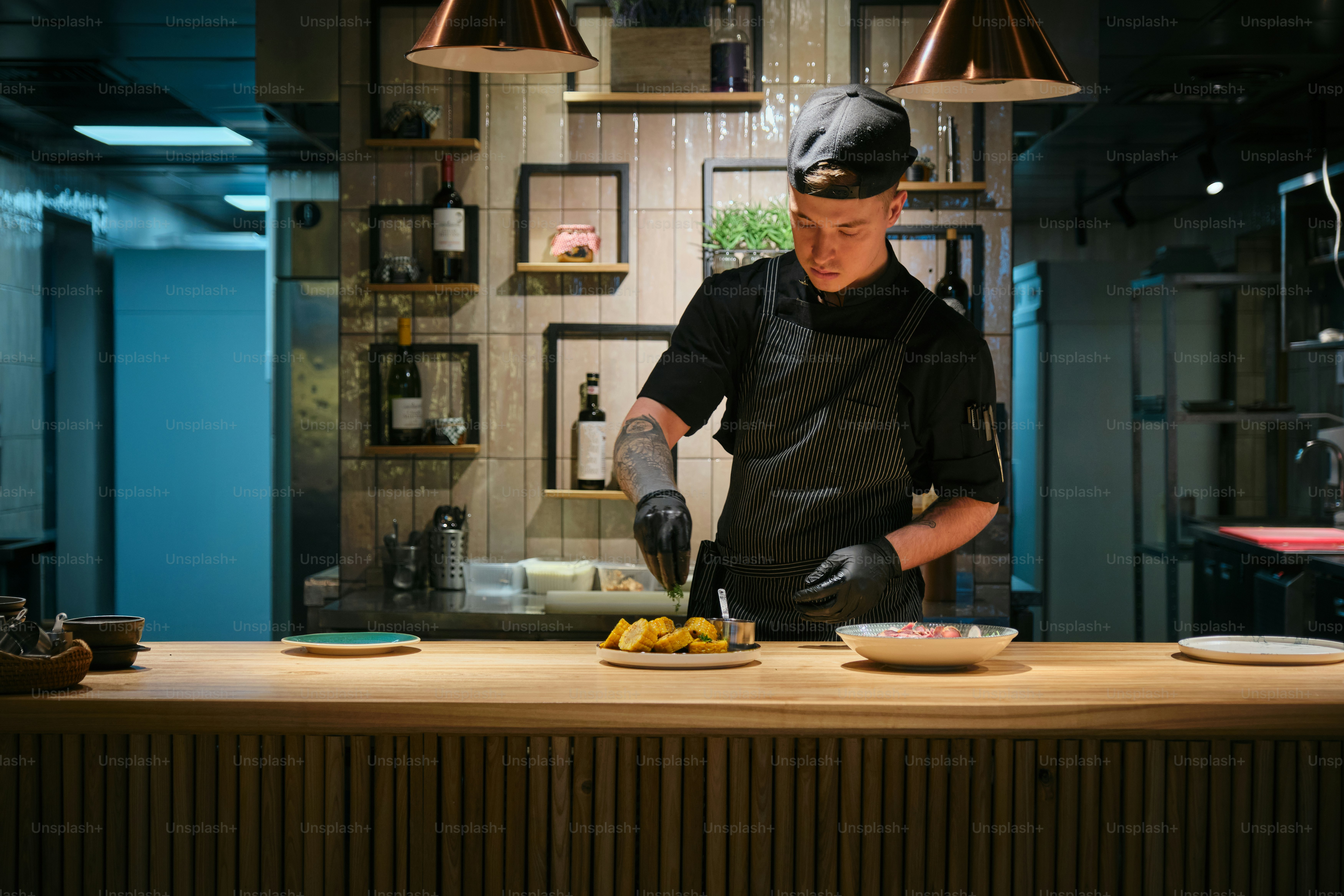 Chef is preparing food in a stylish kitchen.