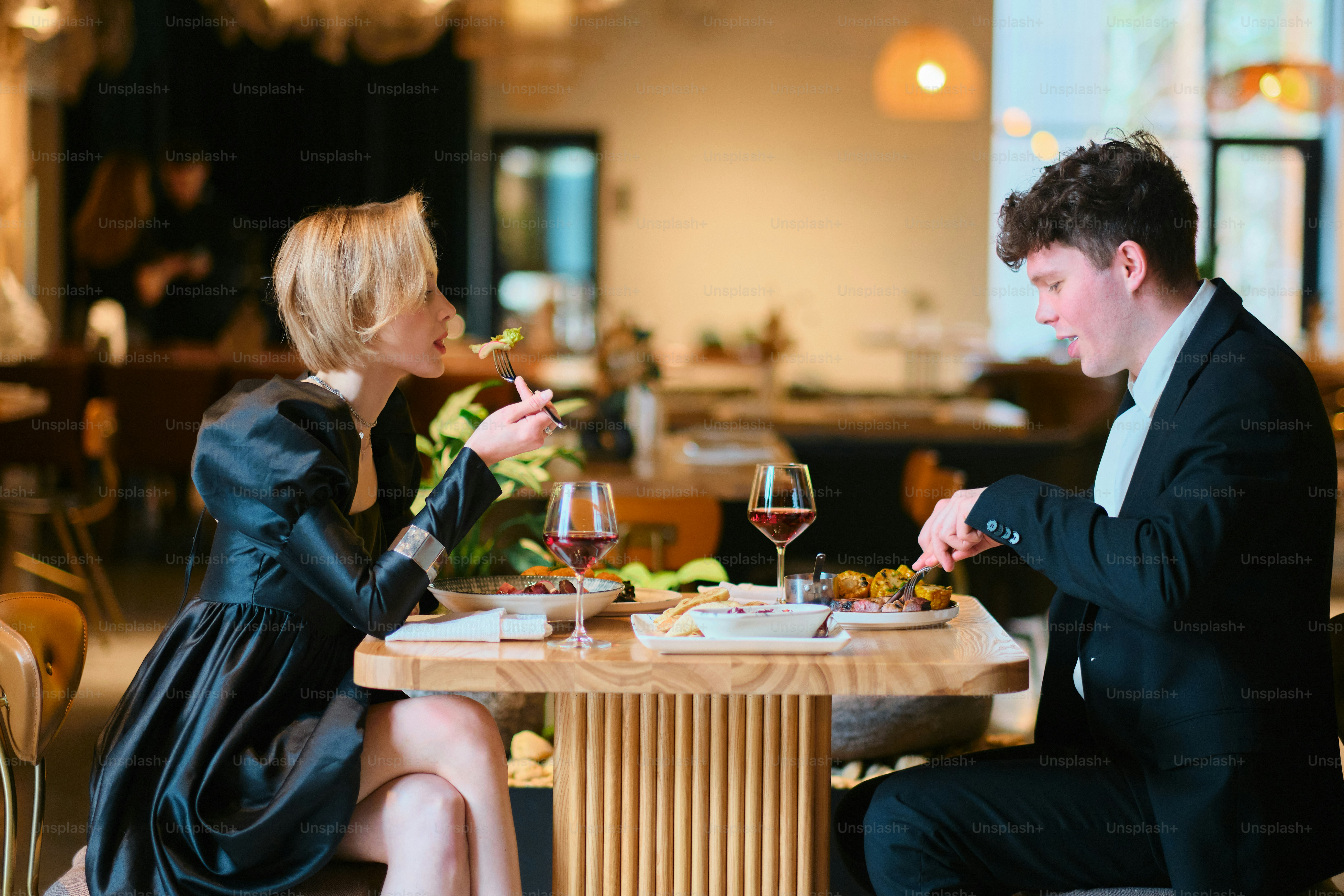 Couple enjoying a fancy meal at a restaurant.