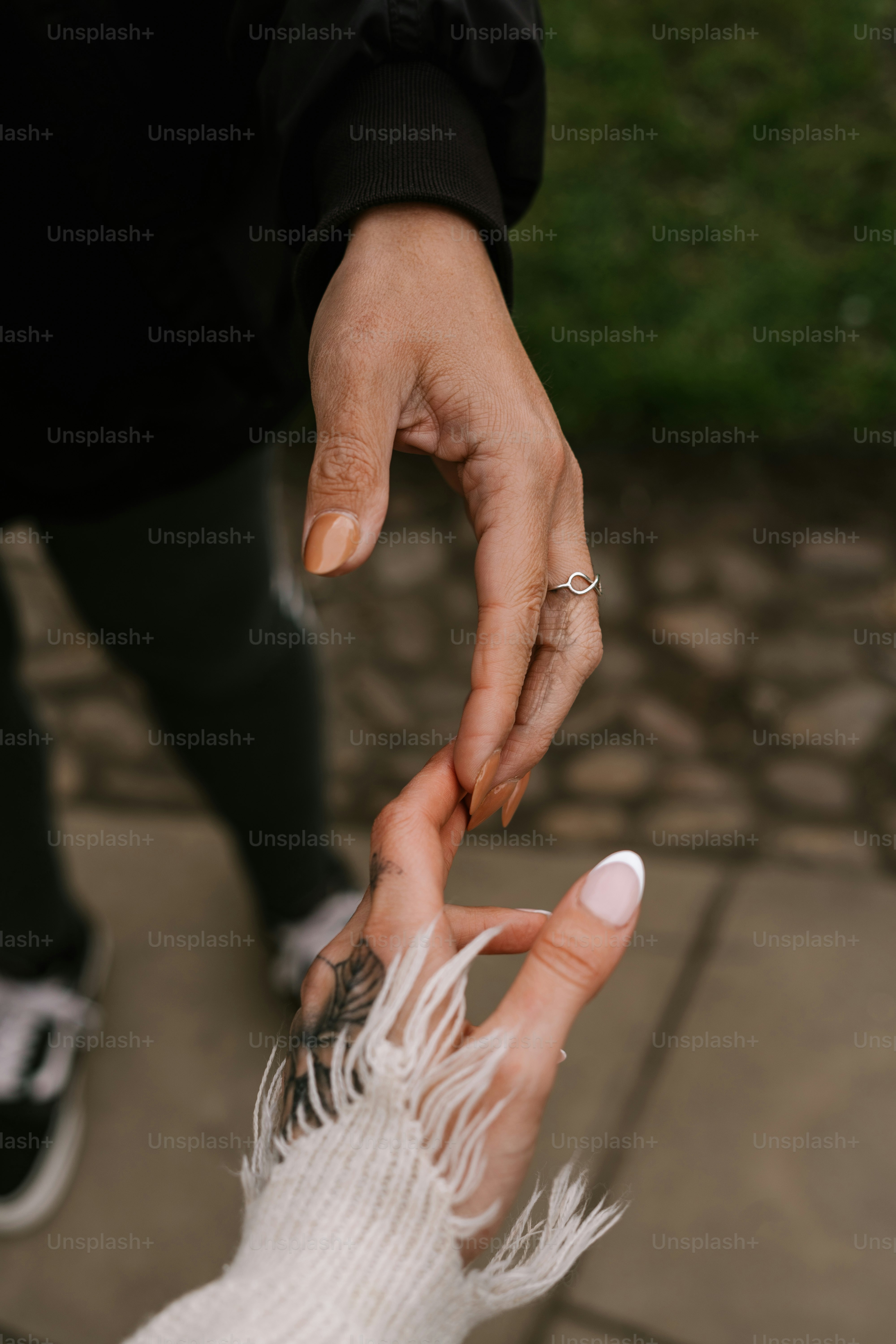 Hands almost touching, a gesture of connection.