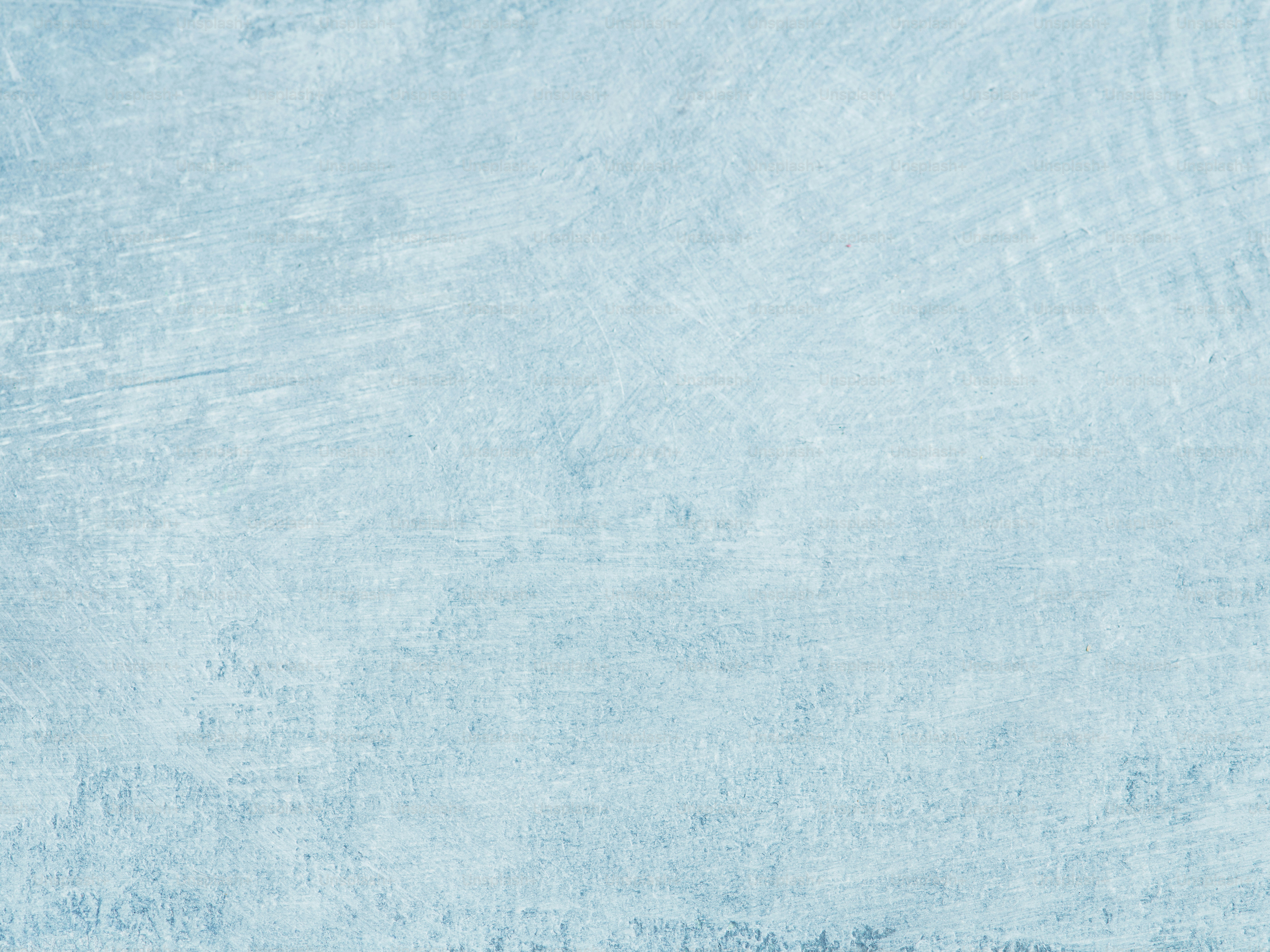 A textured, pale blue background is shown.