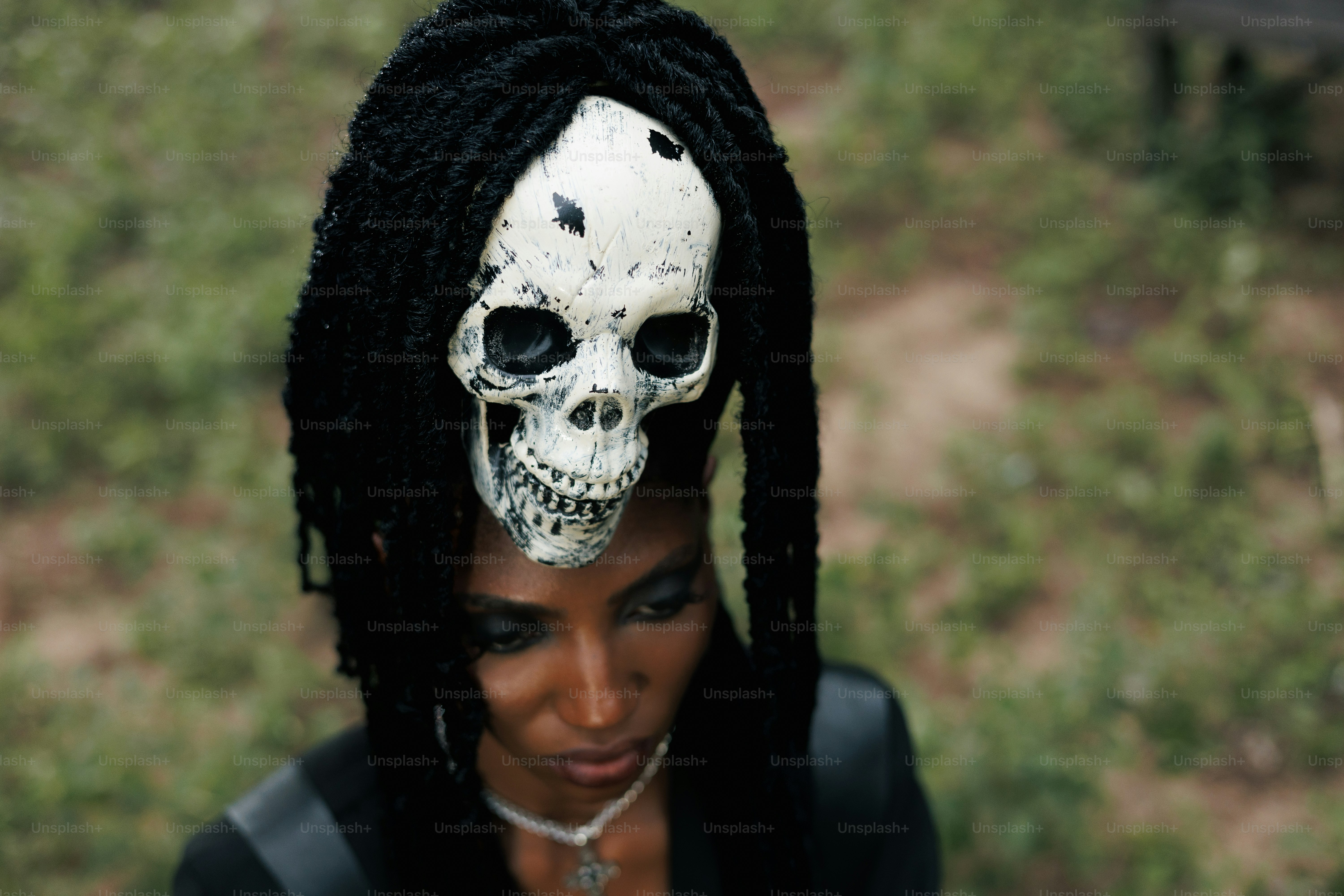 Woman with a skull on her head.