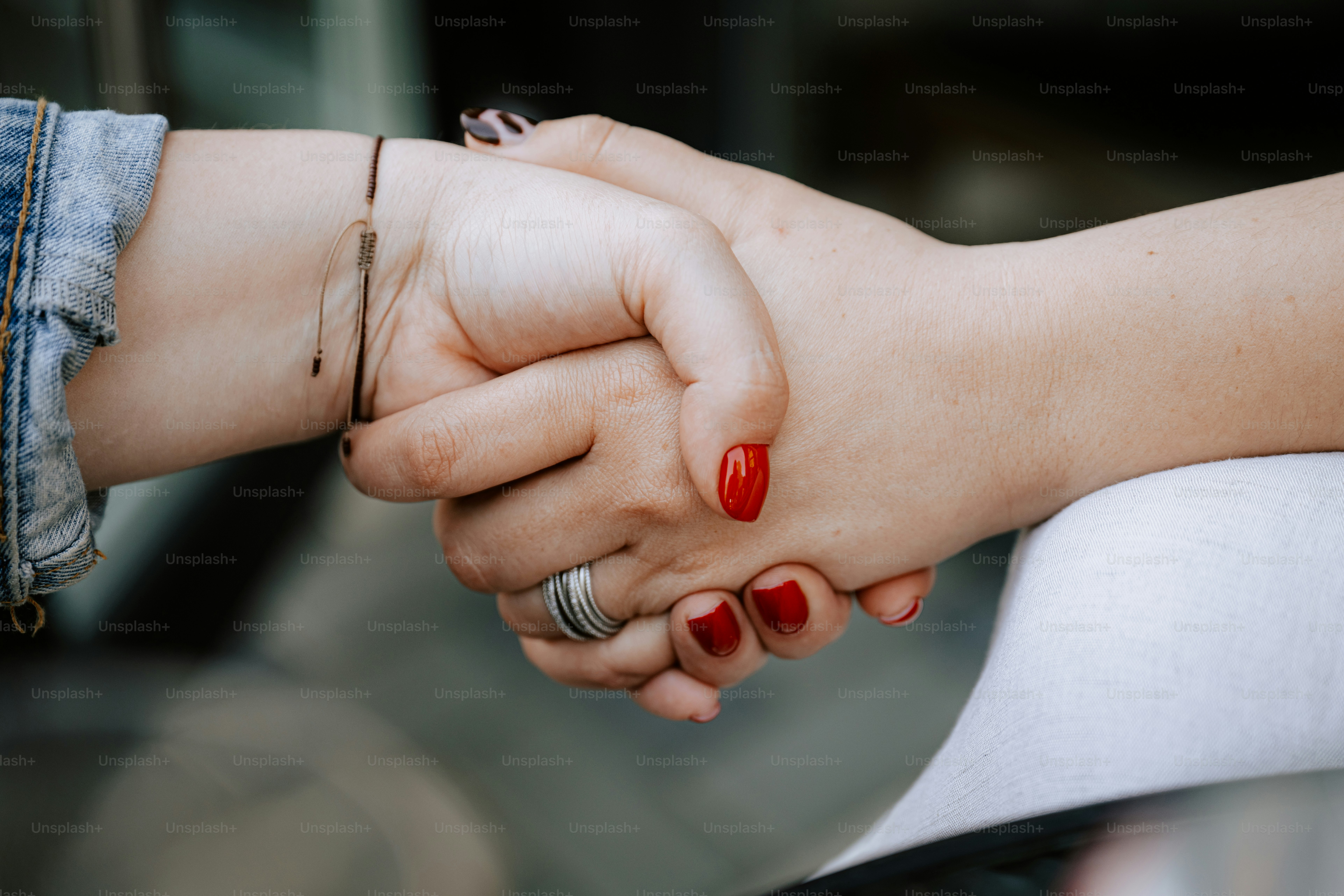 Two hands shake in a gesture of agreement.