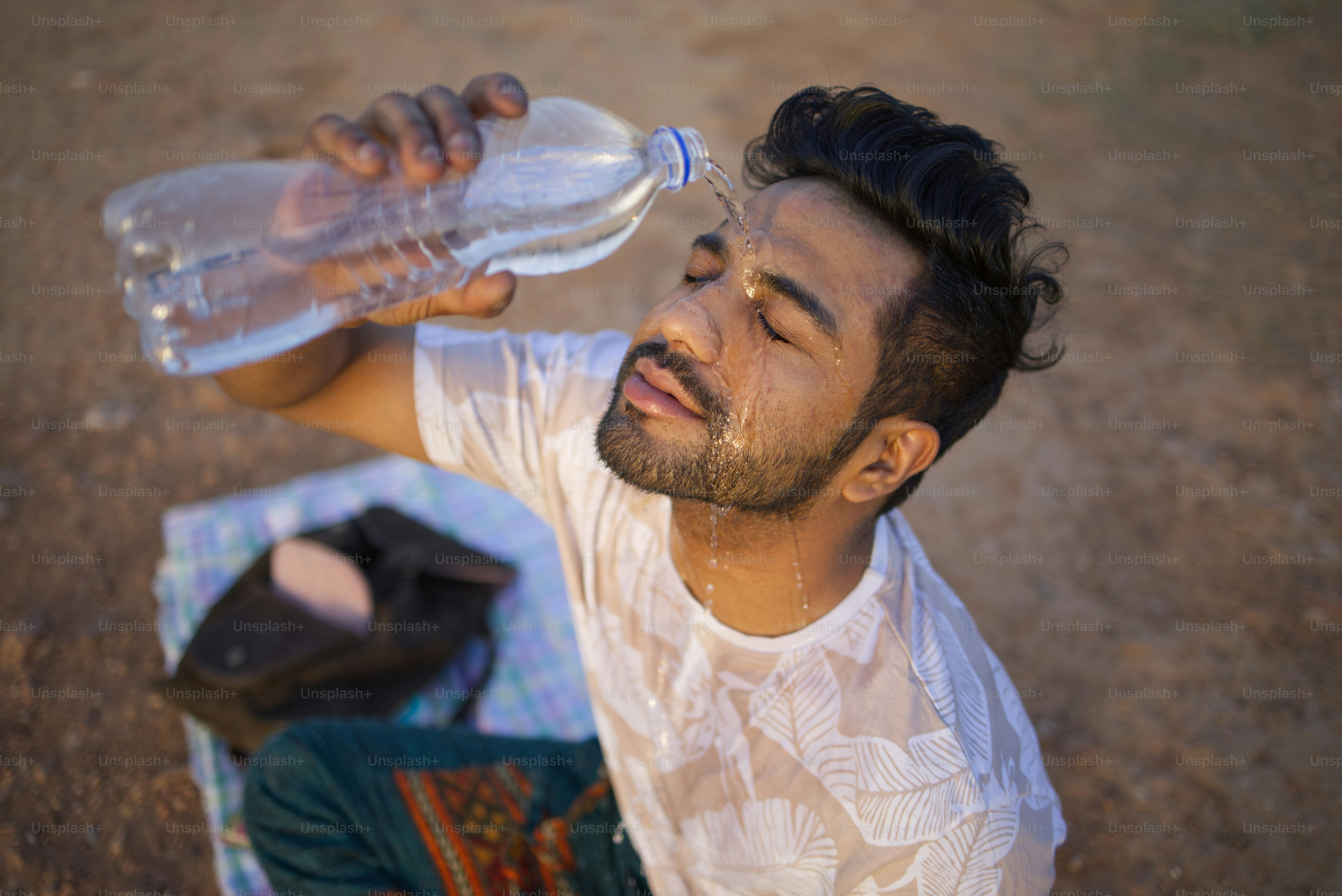 A man cools off with water.
