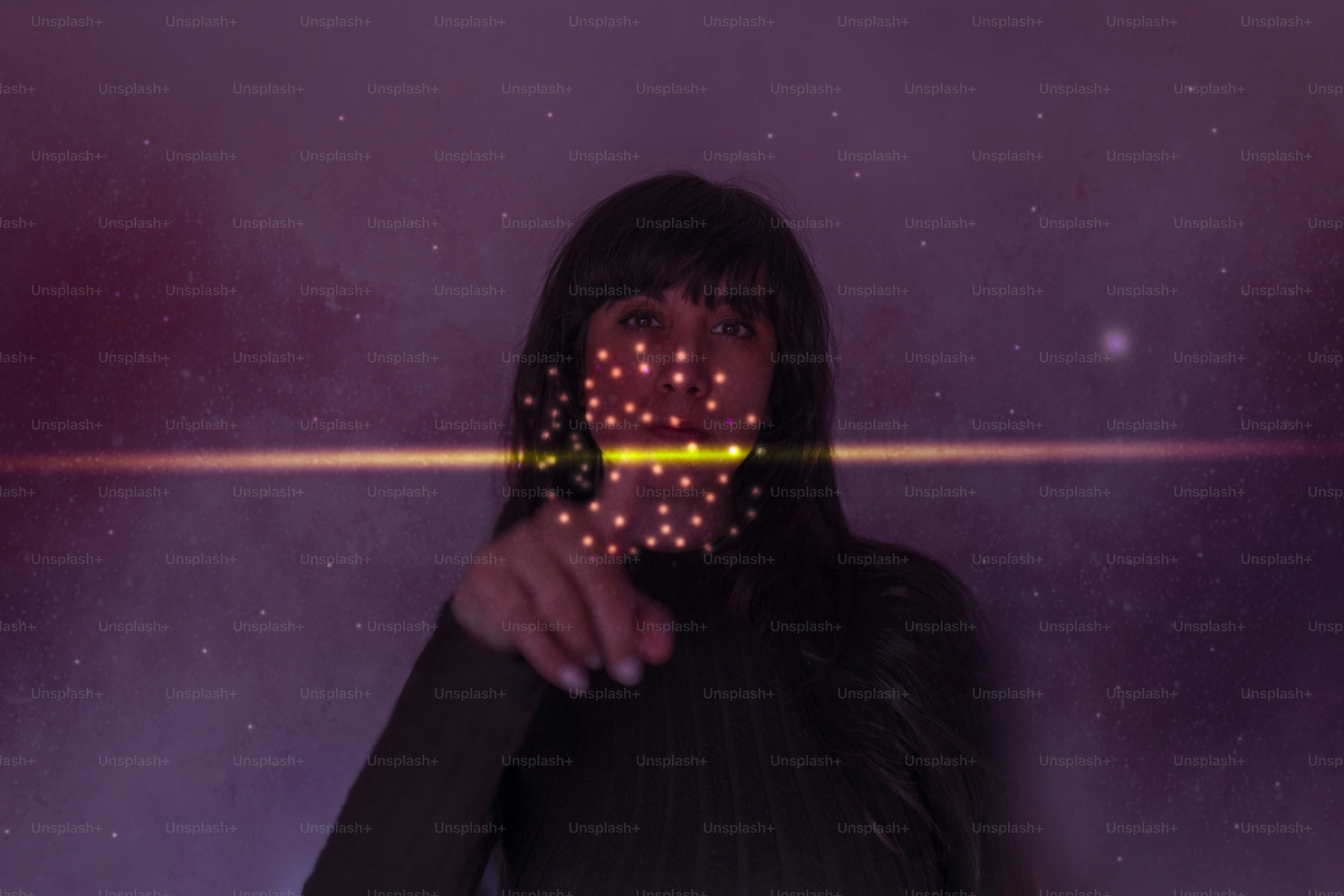 Face recognition technology tracks points on a woman's face.