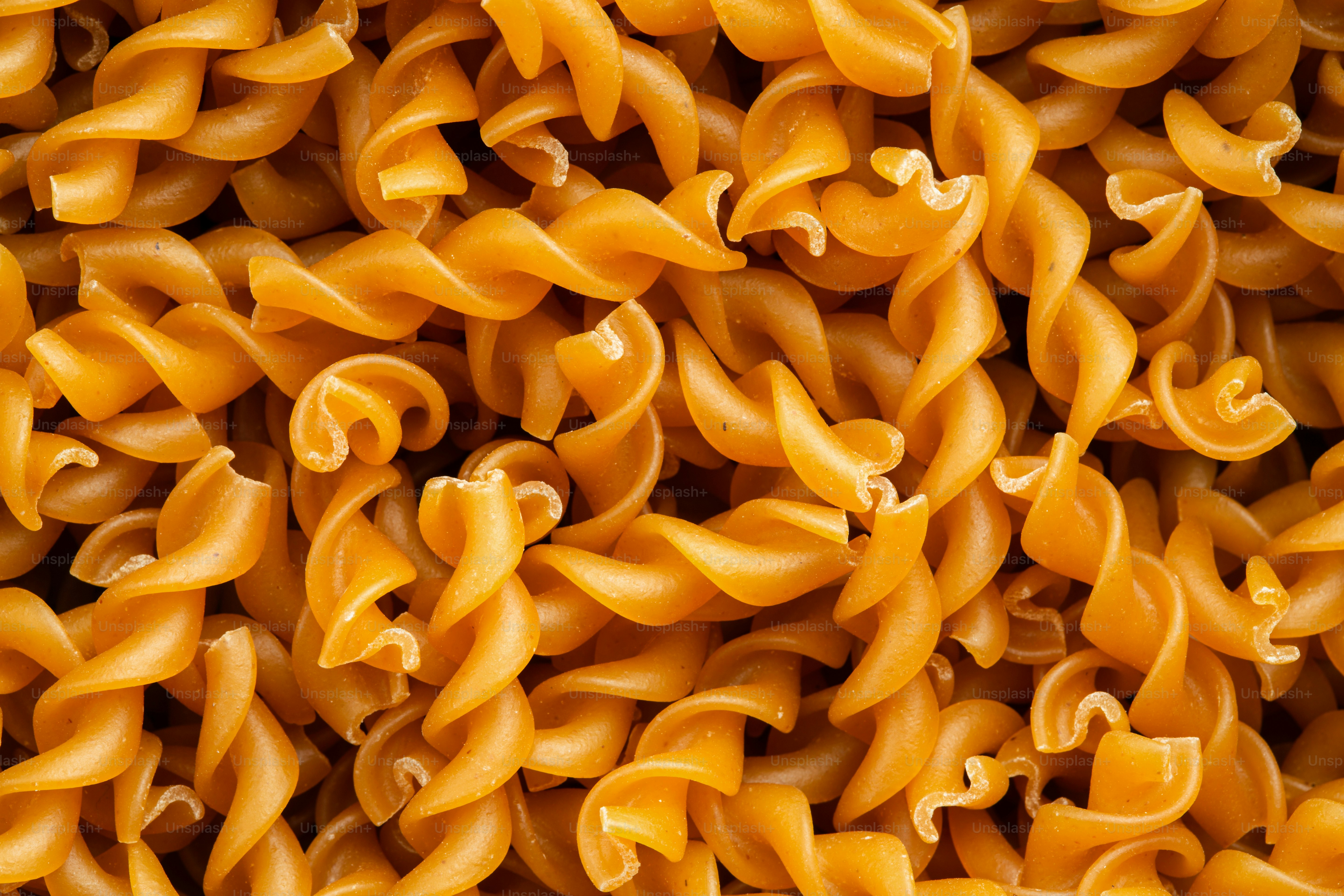 Fusilli pasta is shown in a close-up image.
