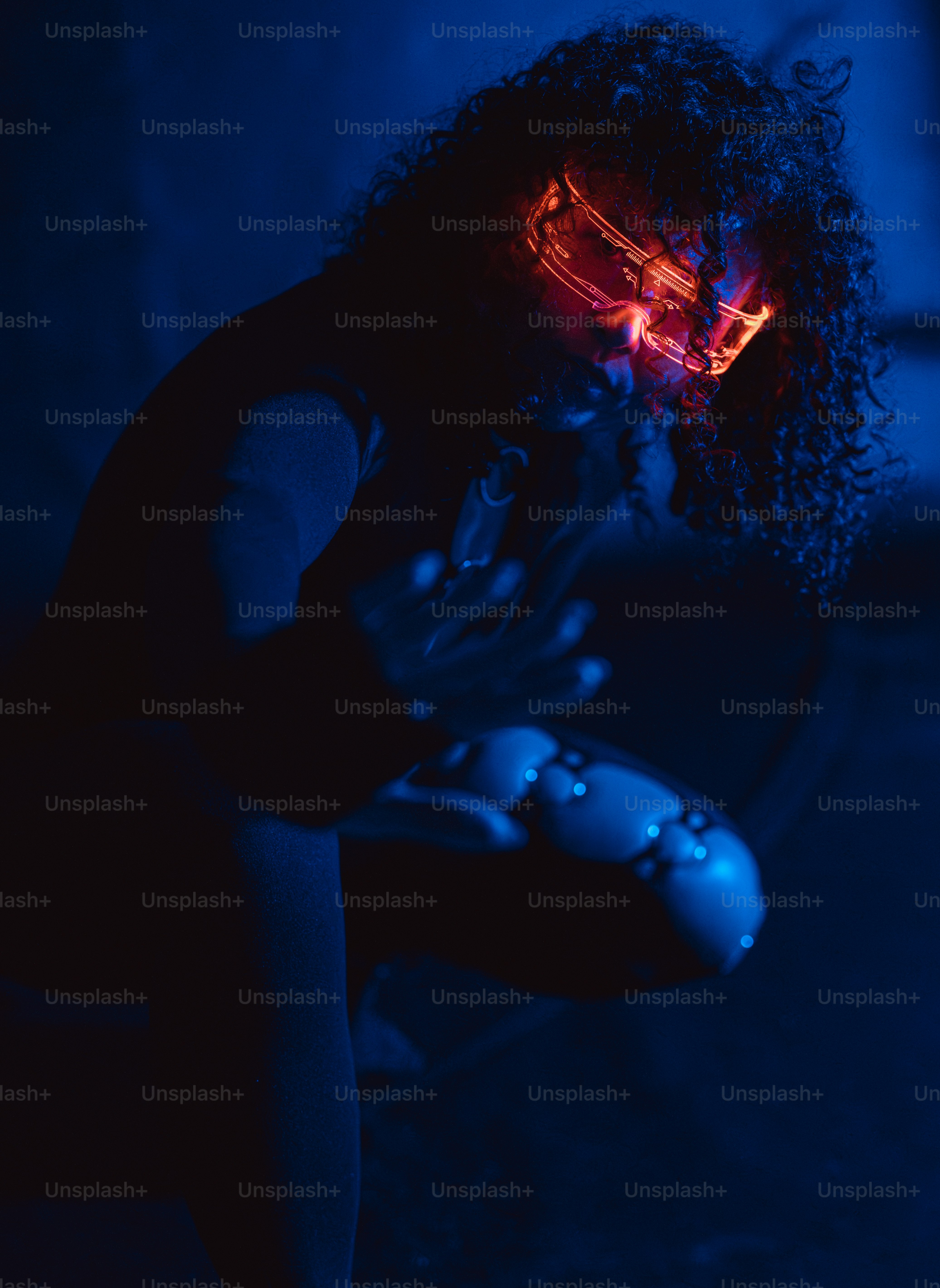 A person wears glowing futuristic eye wear.