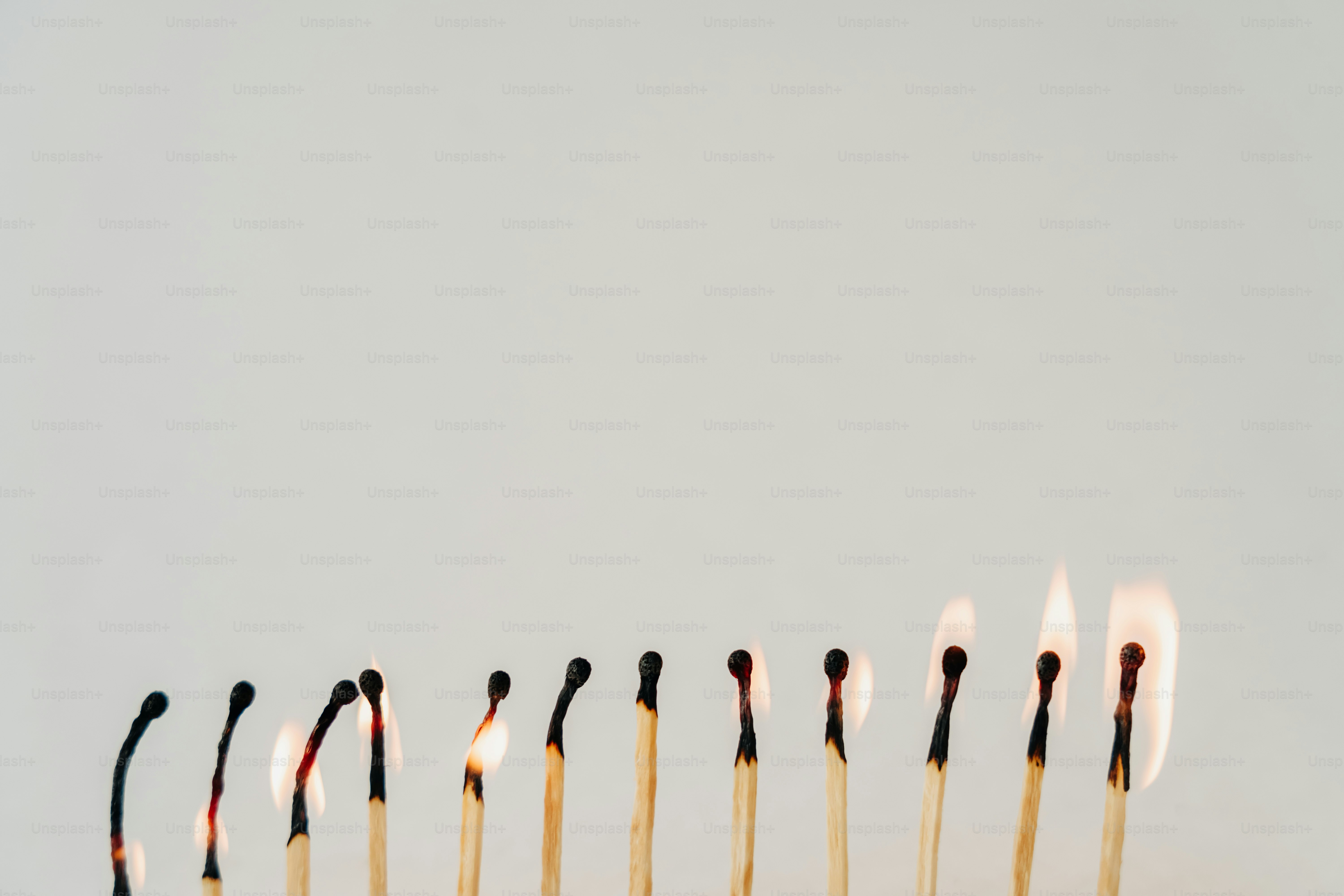 Matches burn along a line, showing progression.