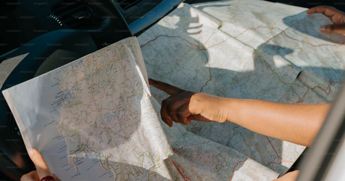 Going In Car People inside a car are planning their road trip. photo – Travel Image ...