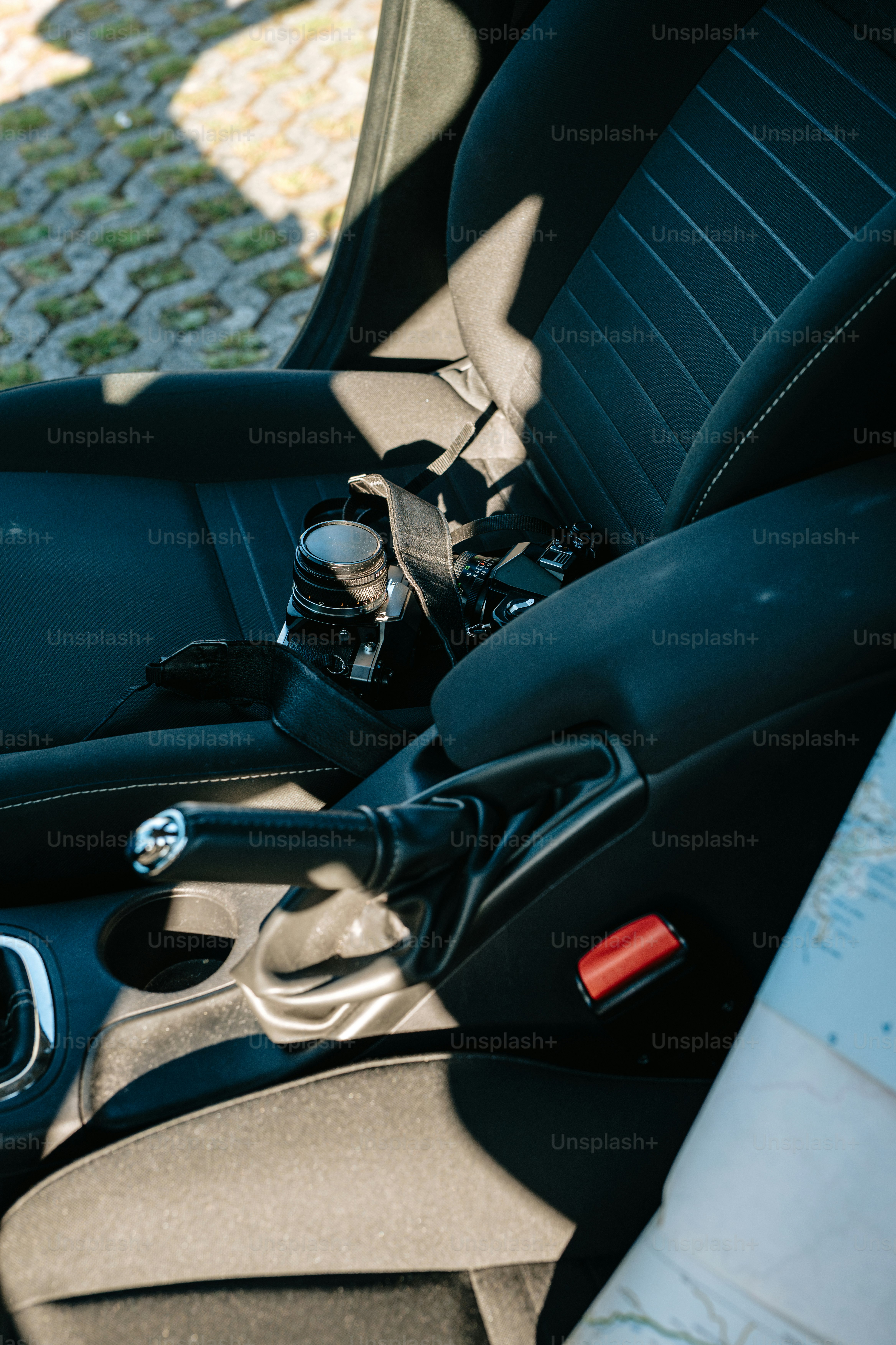 Car interior with objects and shadow.