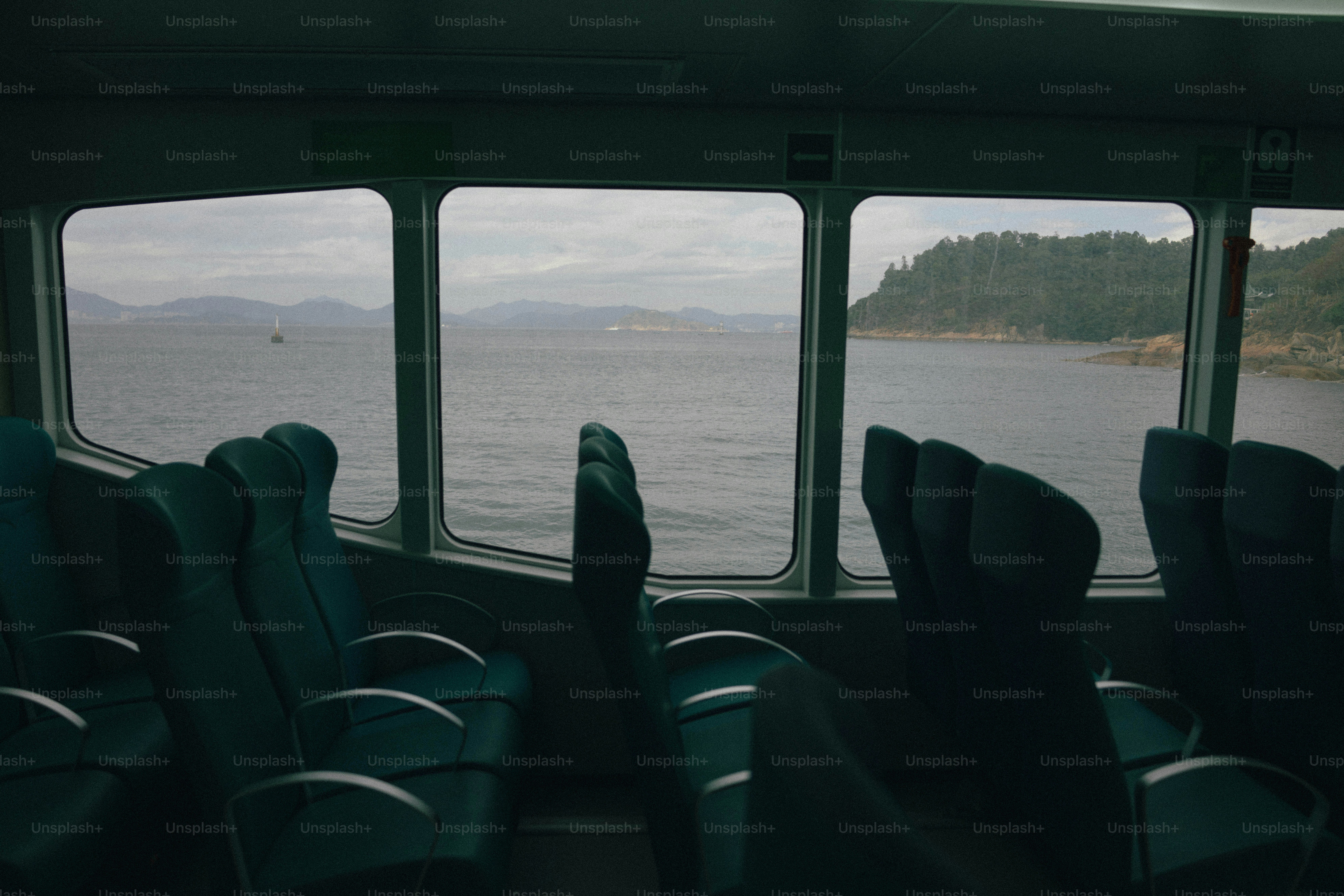 Inside a boat, looking out at a scenic view.