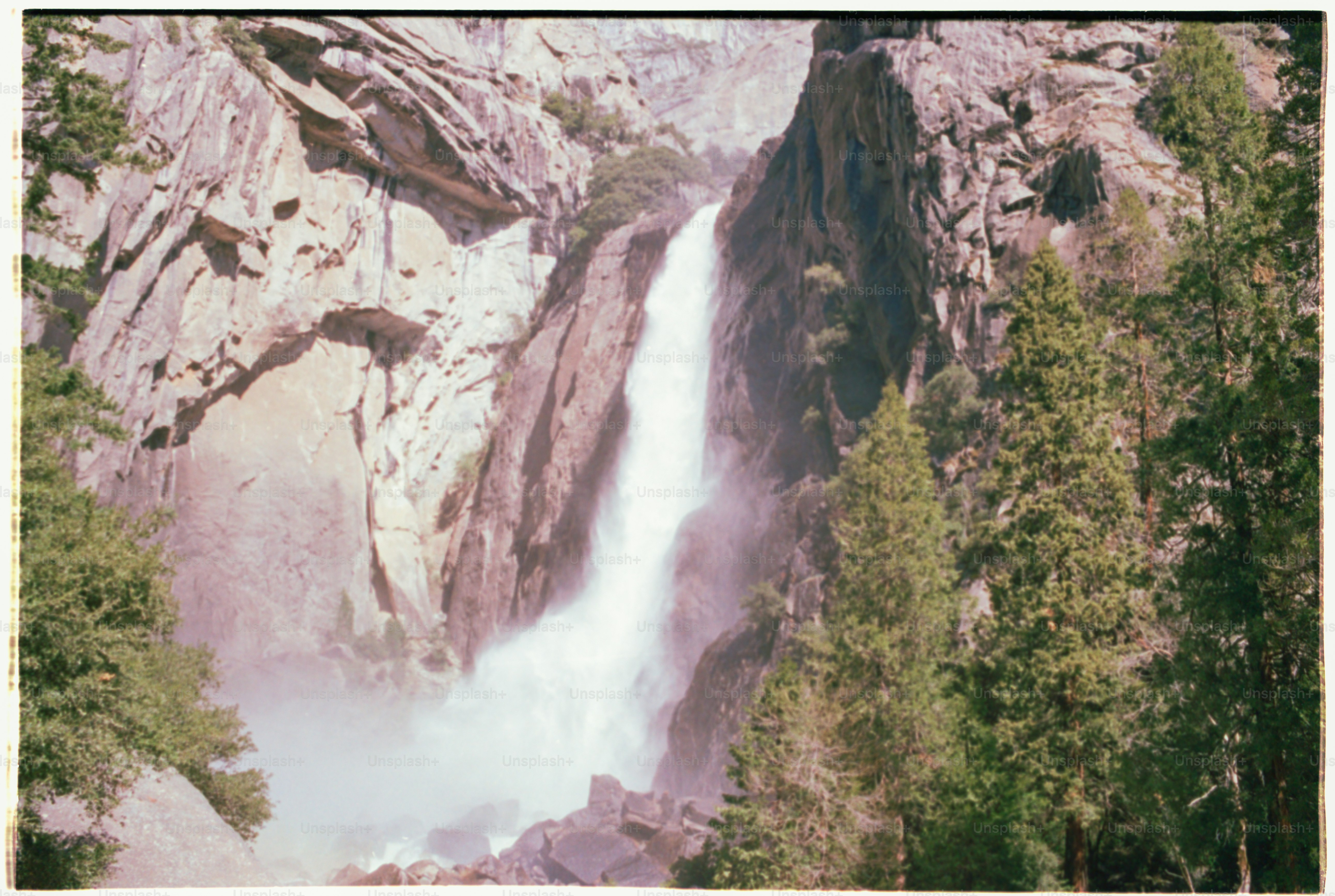 A majestic waterfall cascades down a rocky cliff.