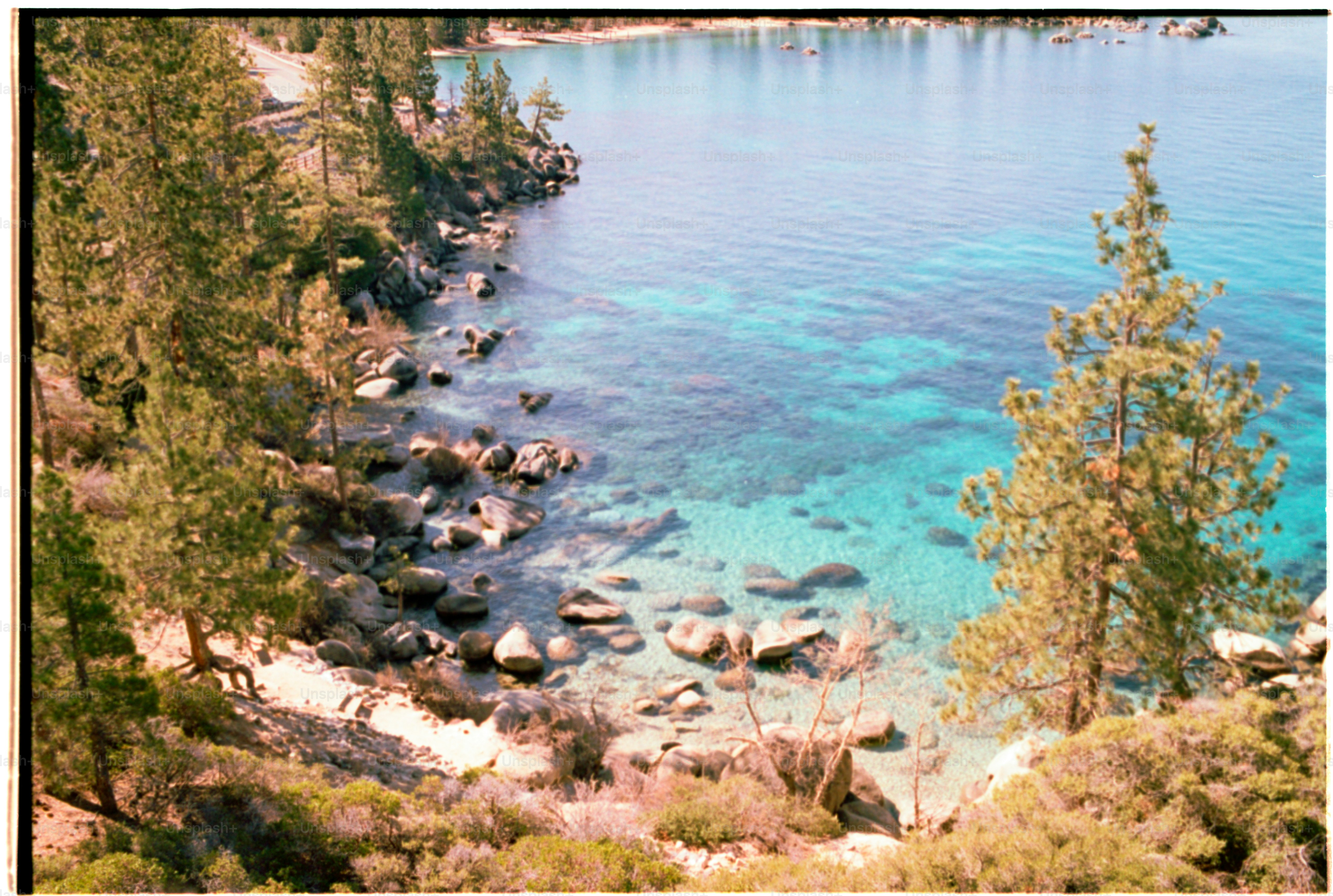 A scenic shoreline with beautiful clear water.
