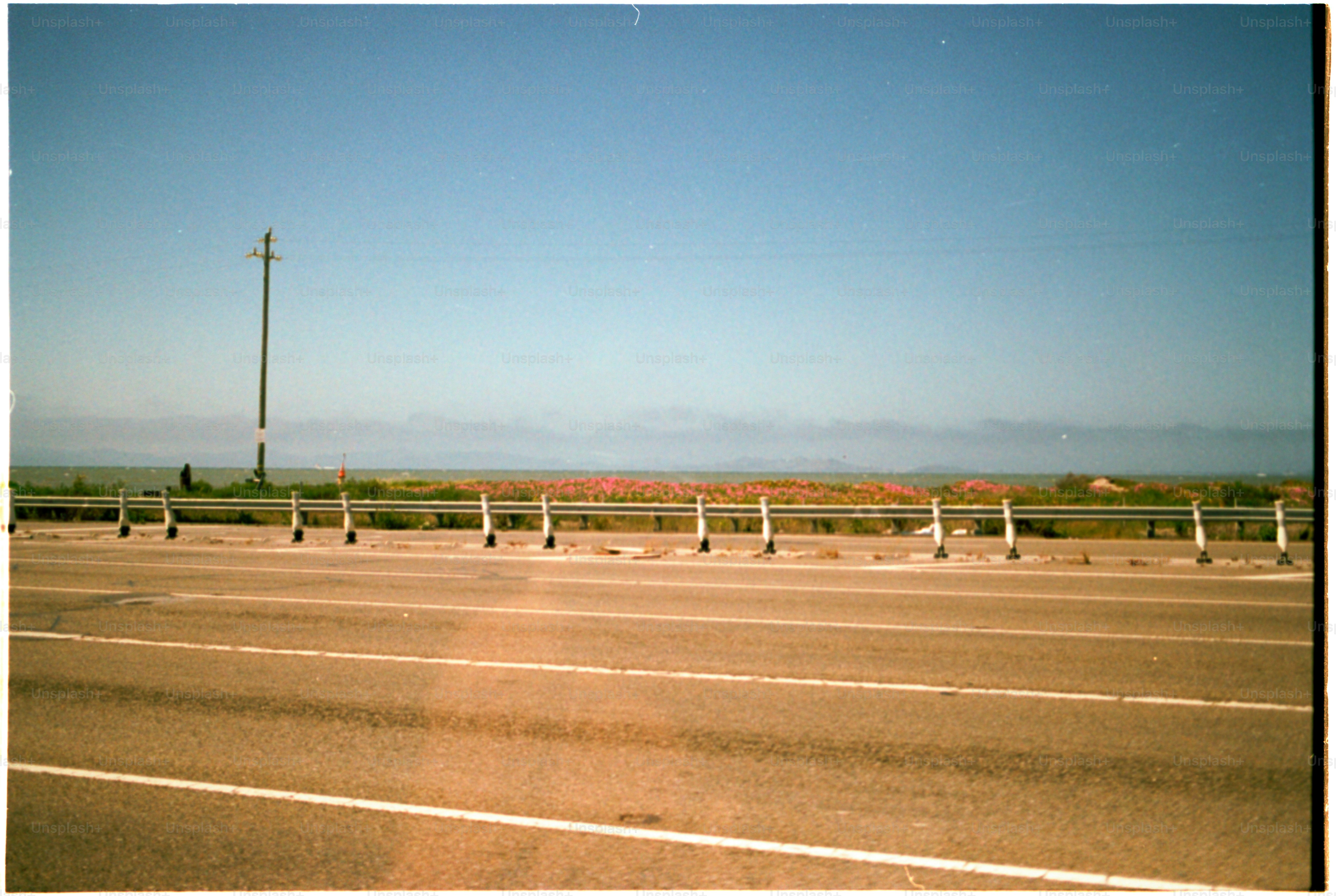 A road leads toward the distant horizon.