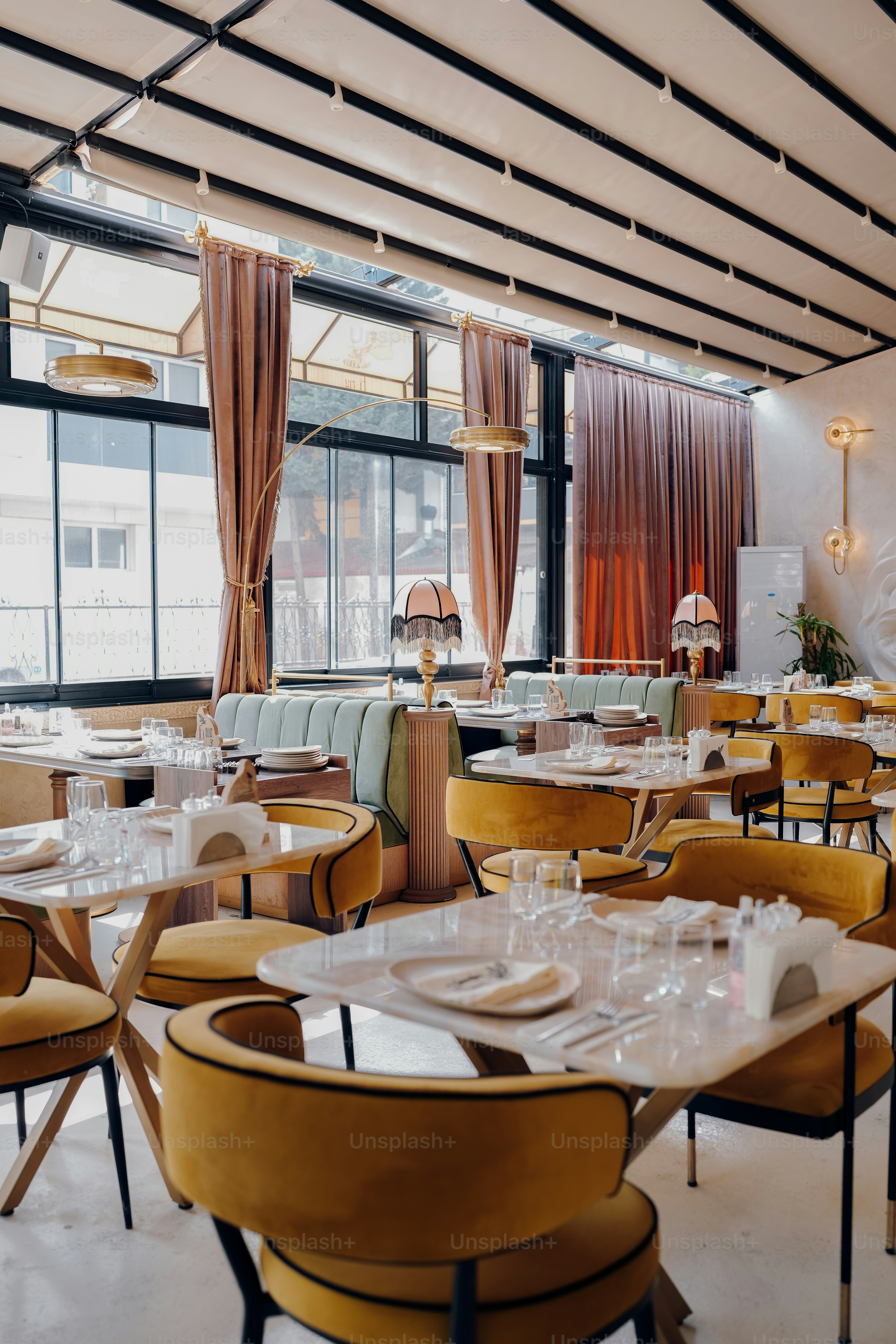 An elegant restaurant interior with velvet furnishings.
