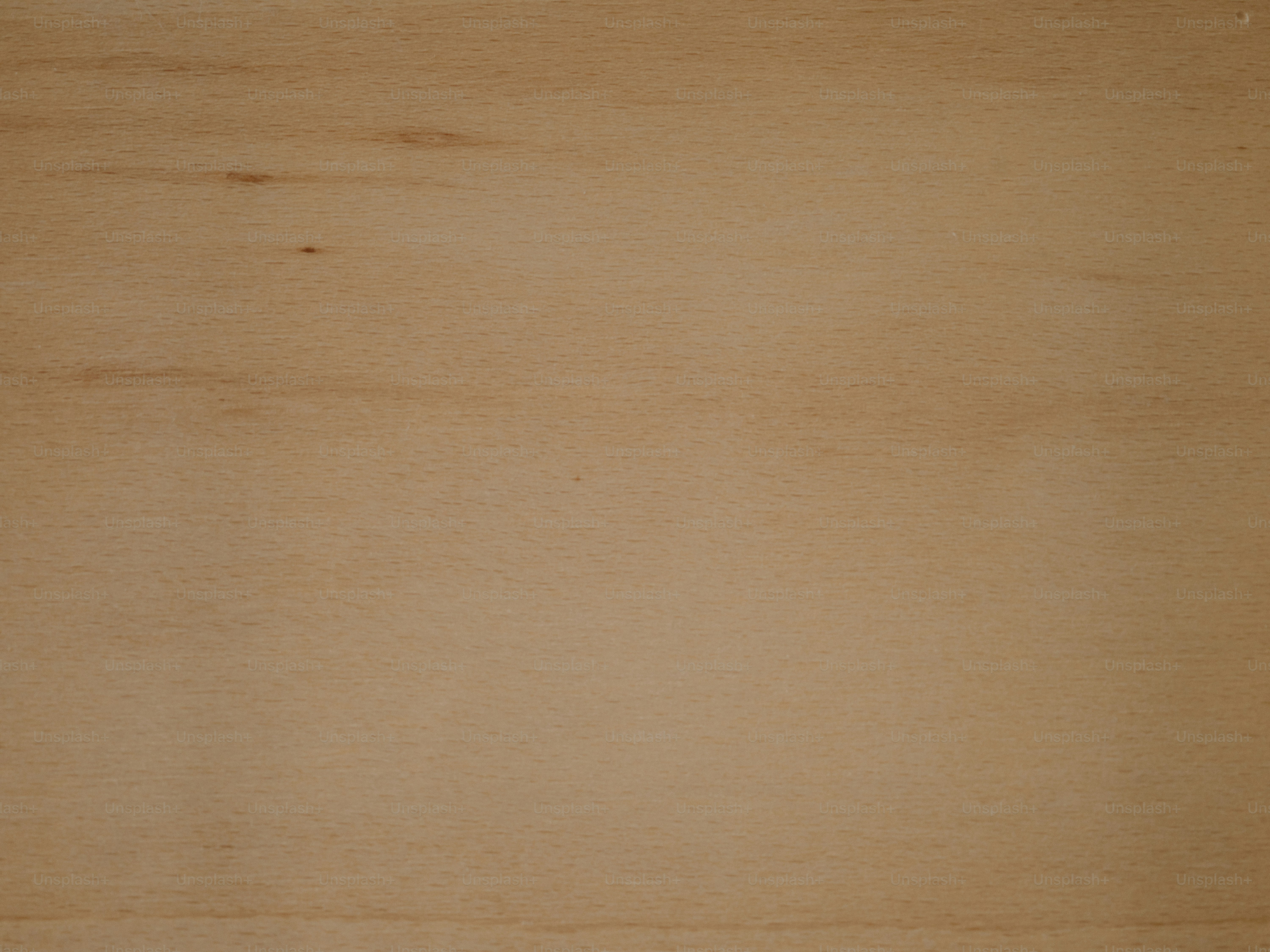 Wood grain texture showing light and dark tones.