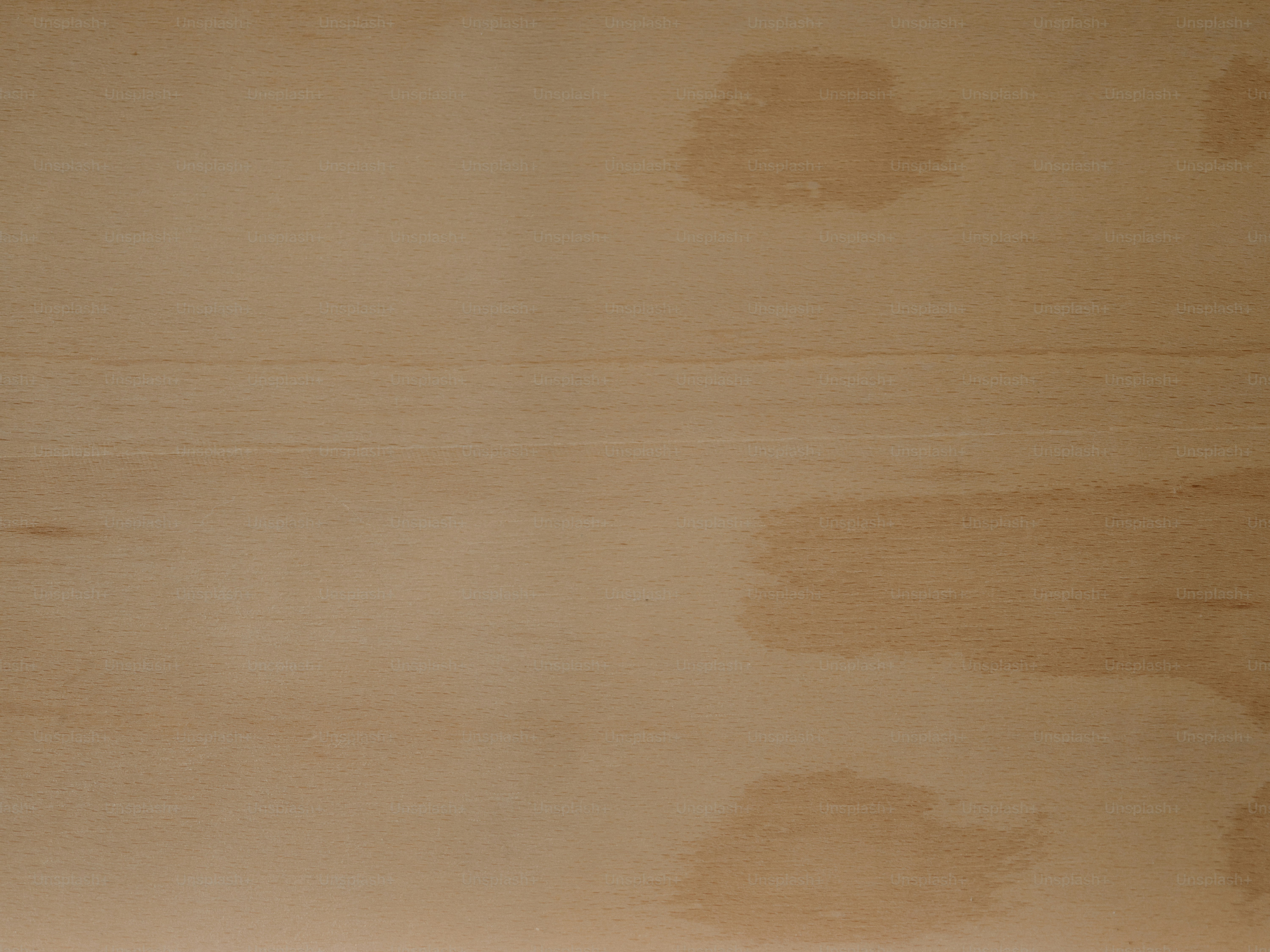 The image shows a stained and weathered surface.