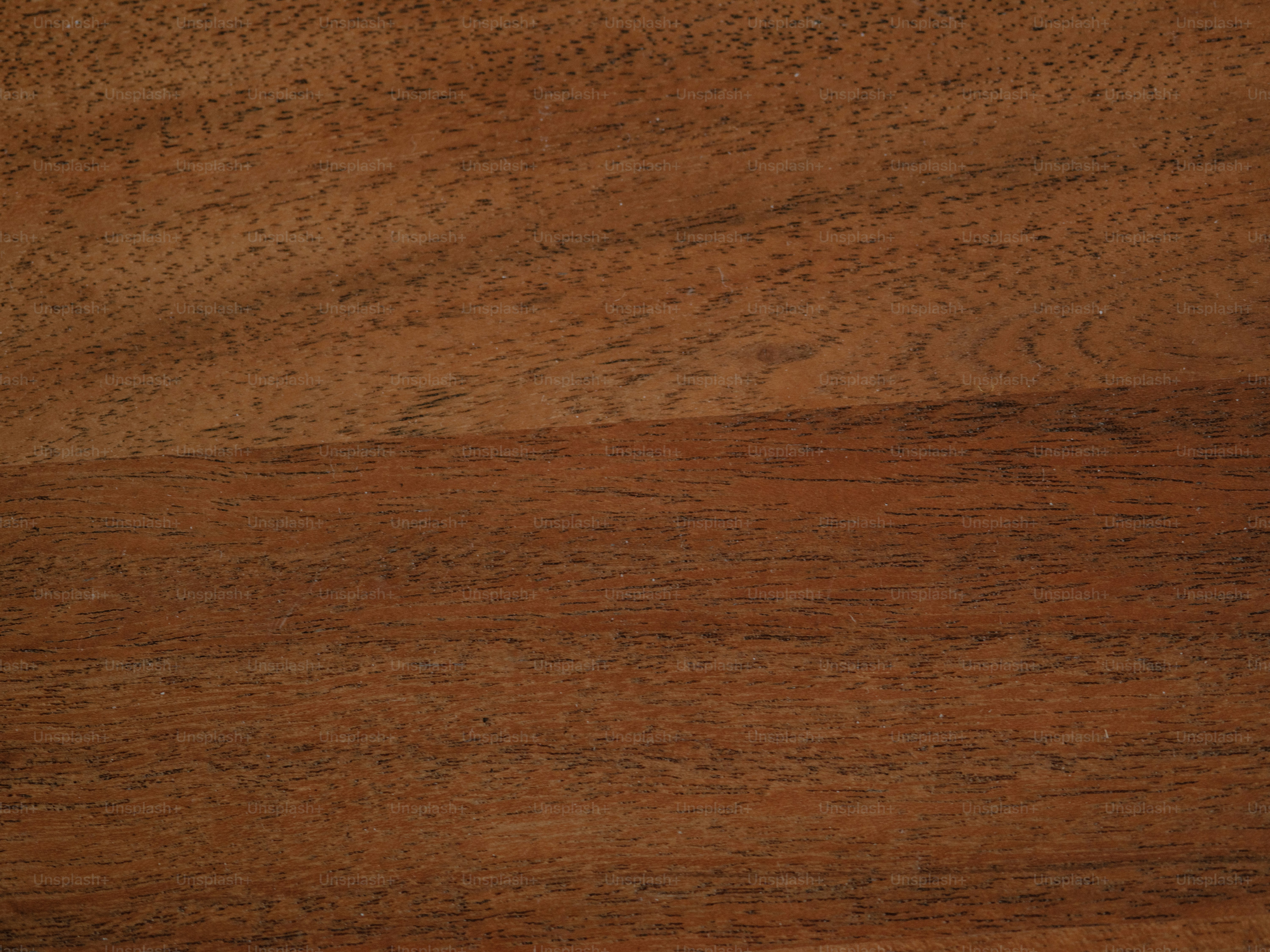 Close-up of a textured, brown wooden surface.