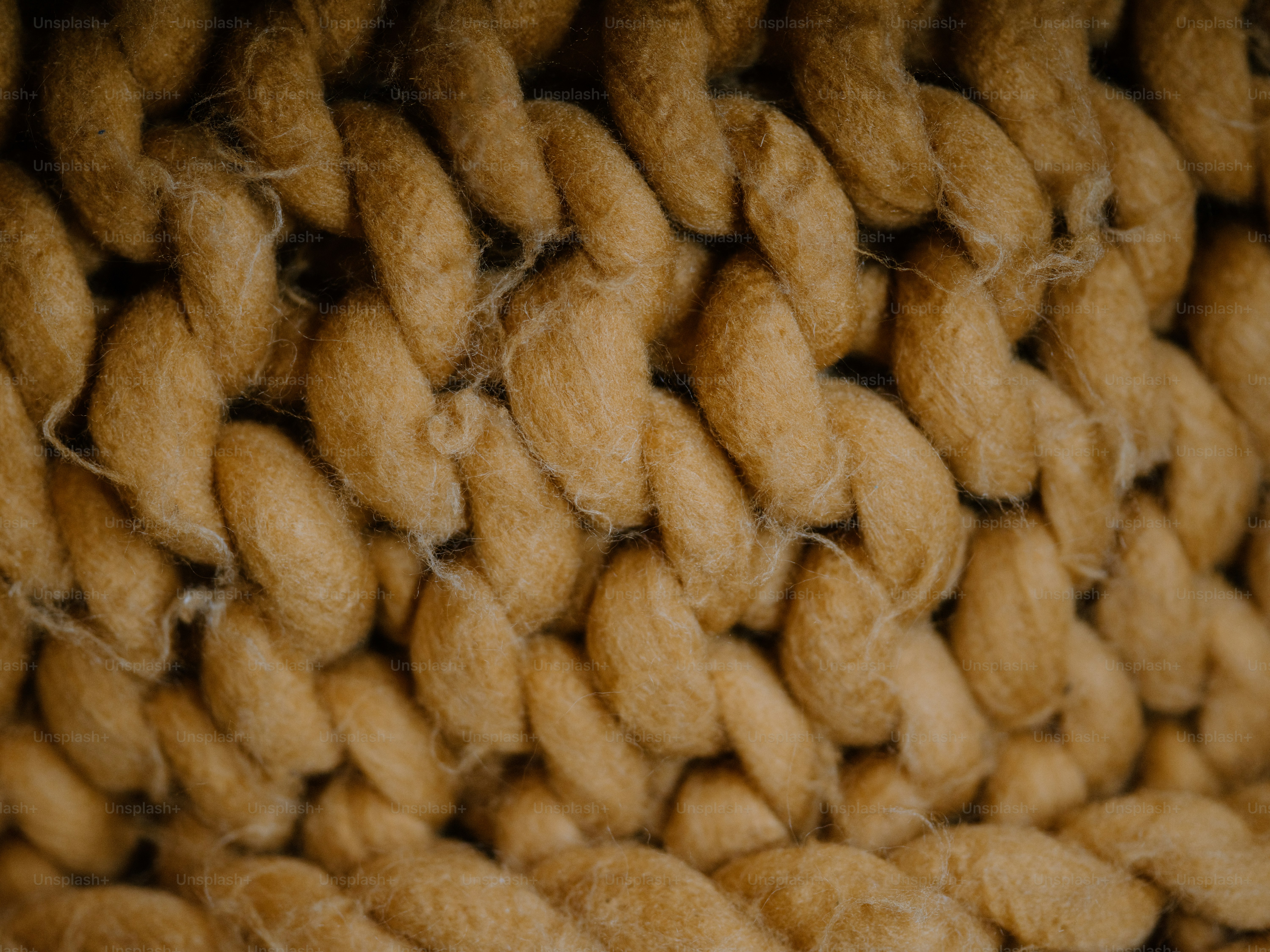 Close-up of woven, textured brown yarn.