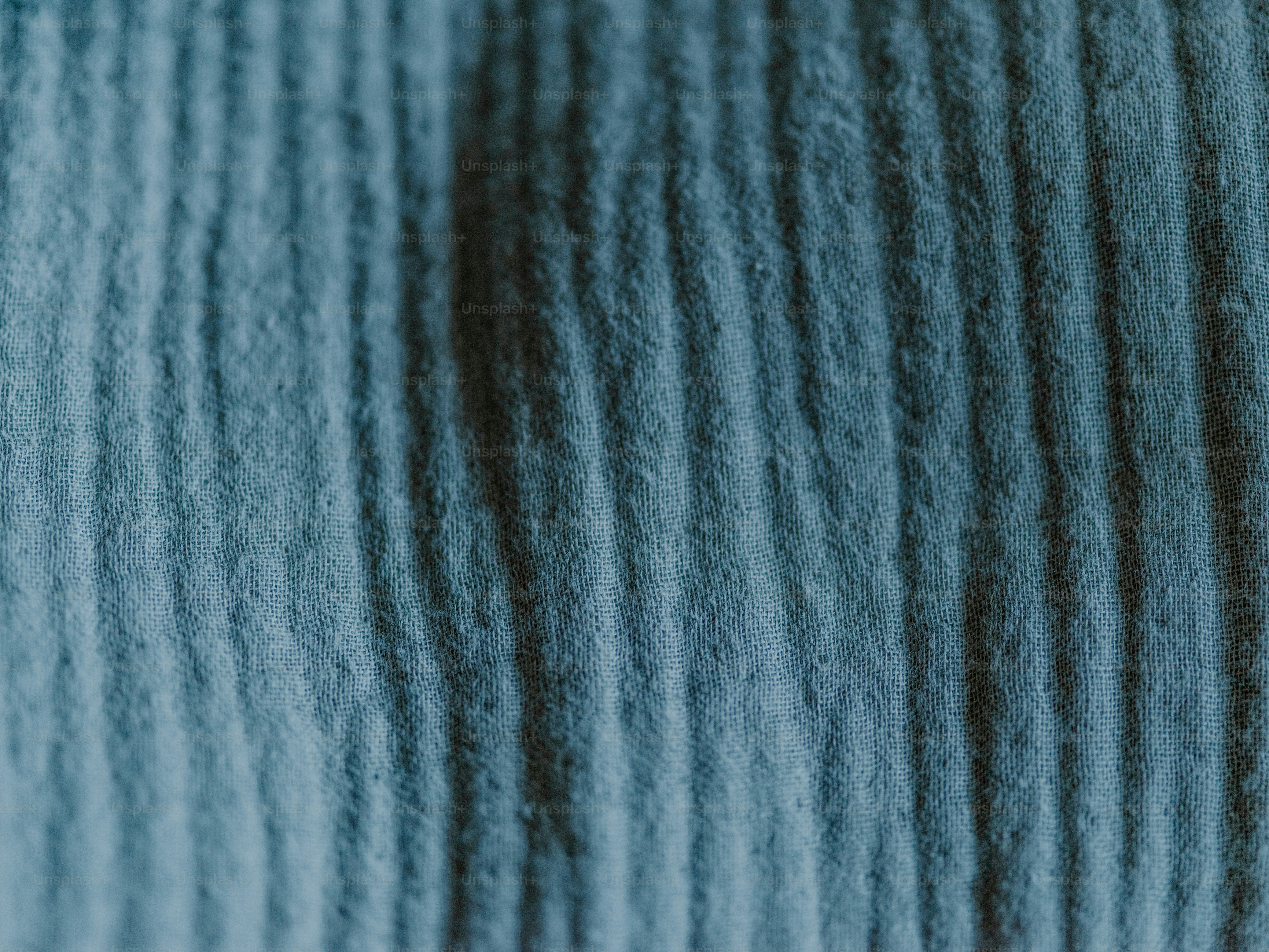 Close-up of blue corduroy fabric.