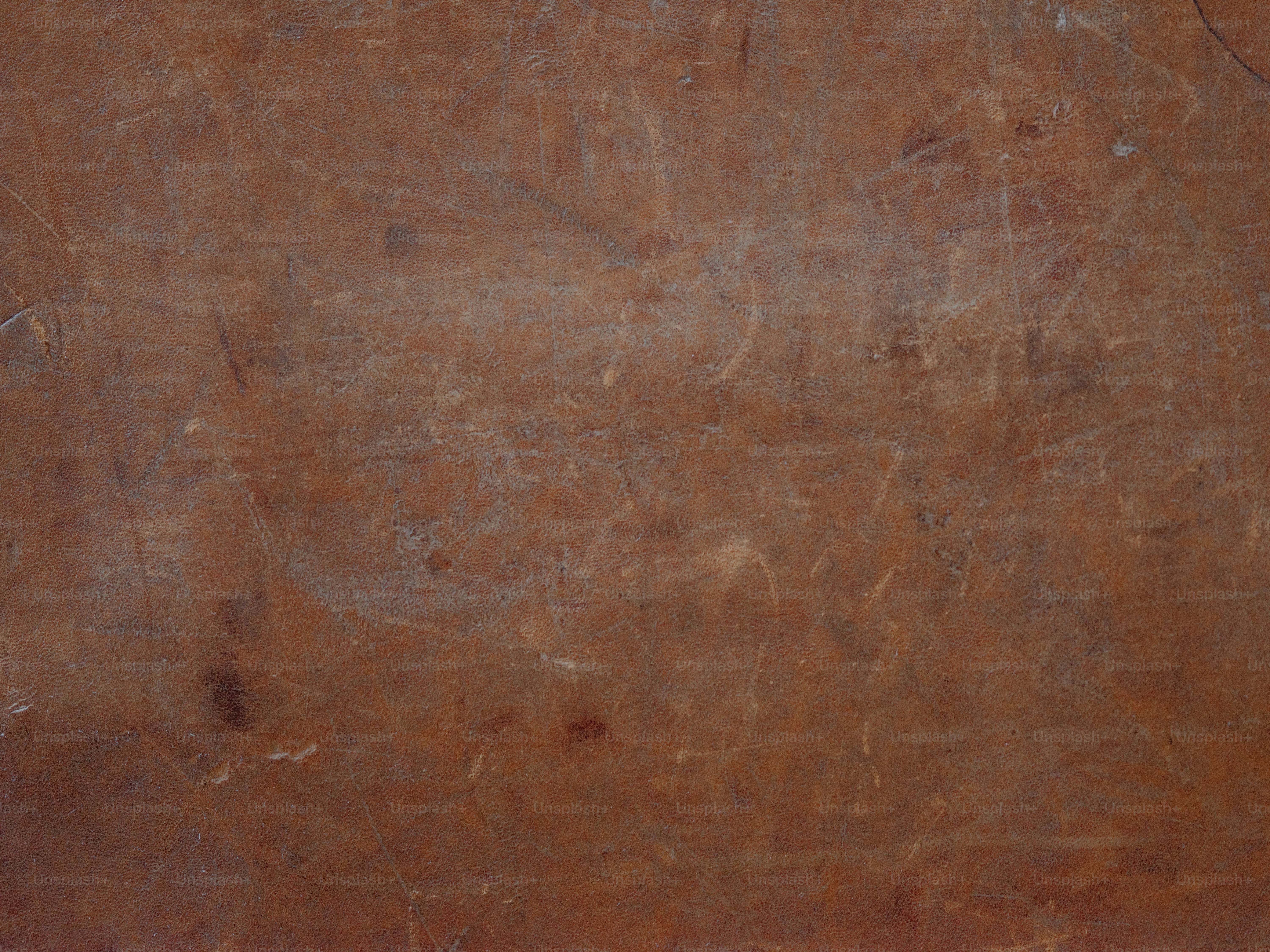 Scratched and weathered brown surface.