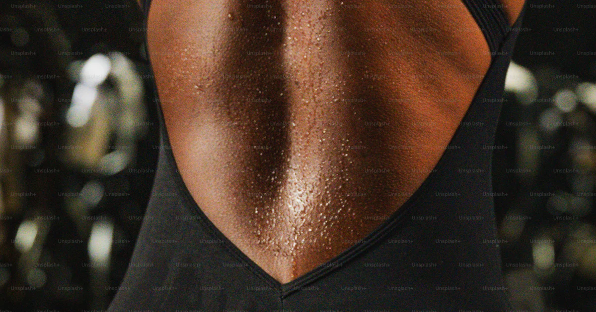 A sweaty back displays after an intense workout. photo – Exercise Image ...