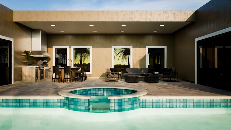 Outdoor kitchen and patio with evening lighting