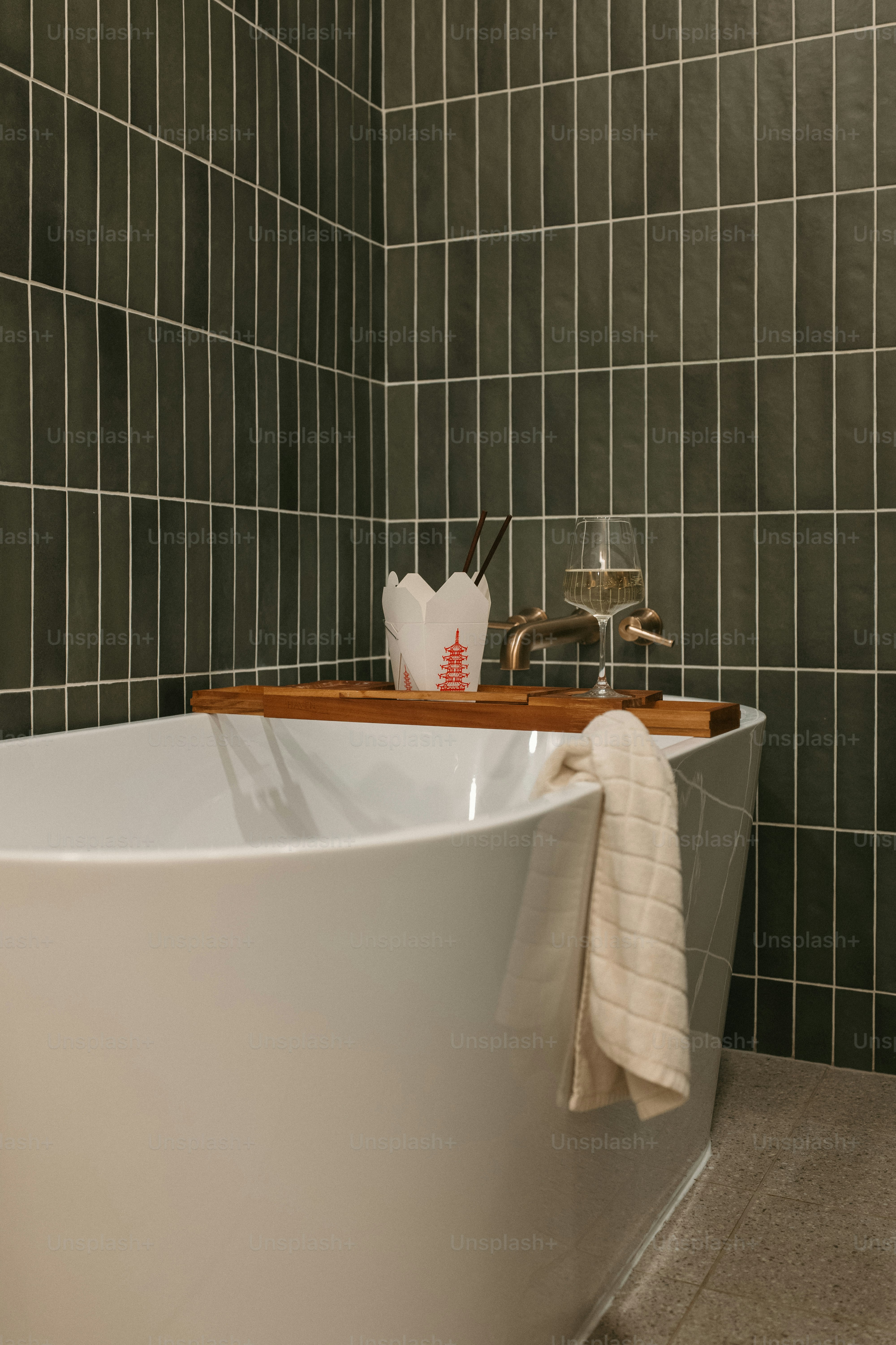 A relaxing bath: takeout, towel, and wine.