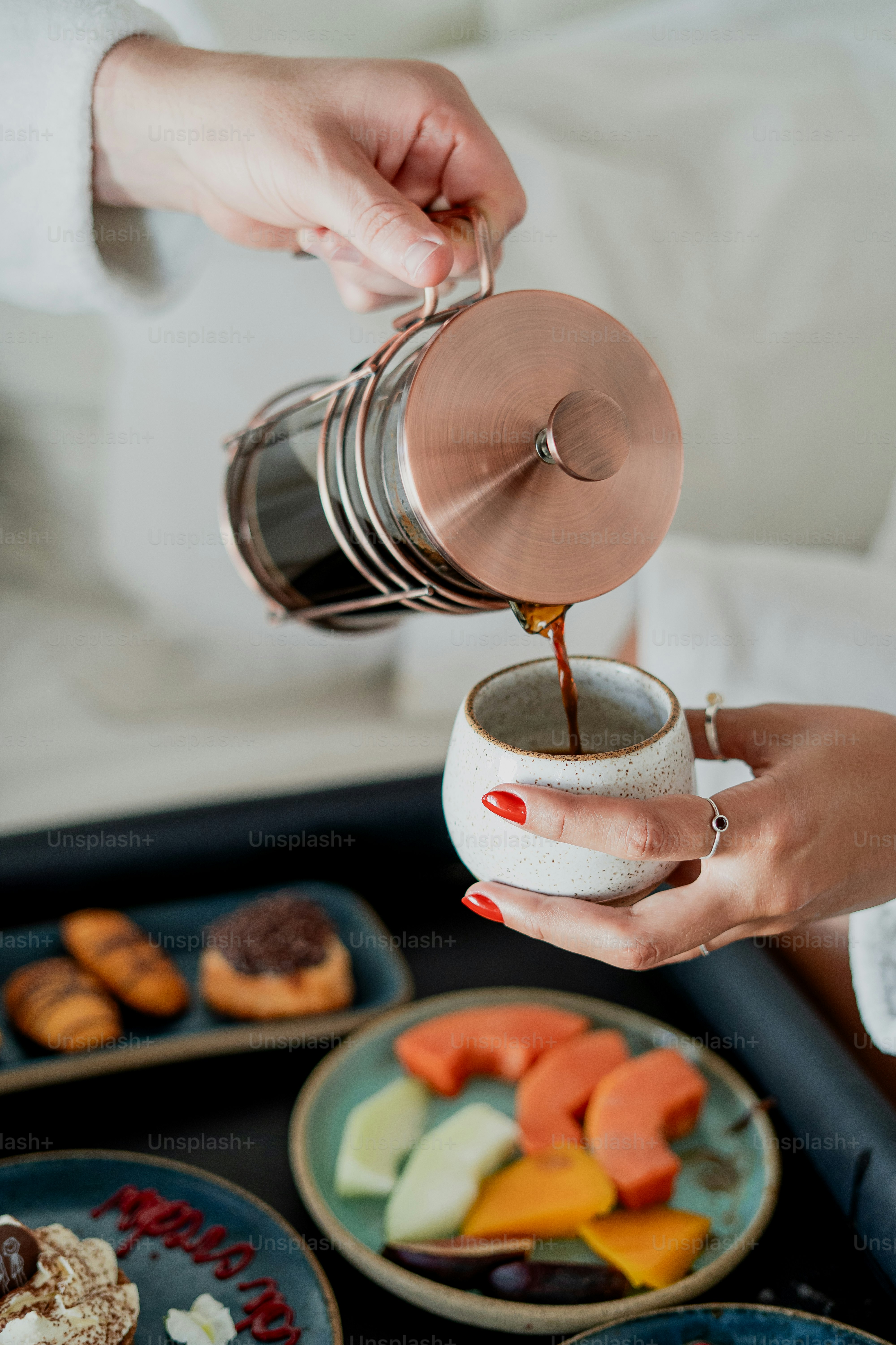 Coffee is being poured into a cup.
