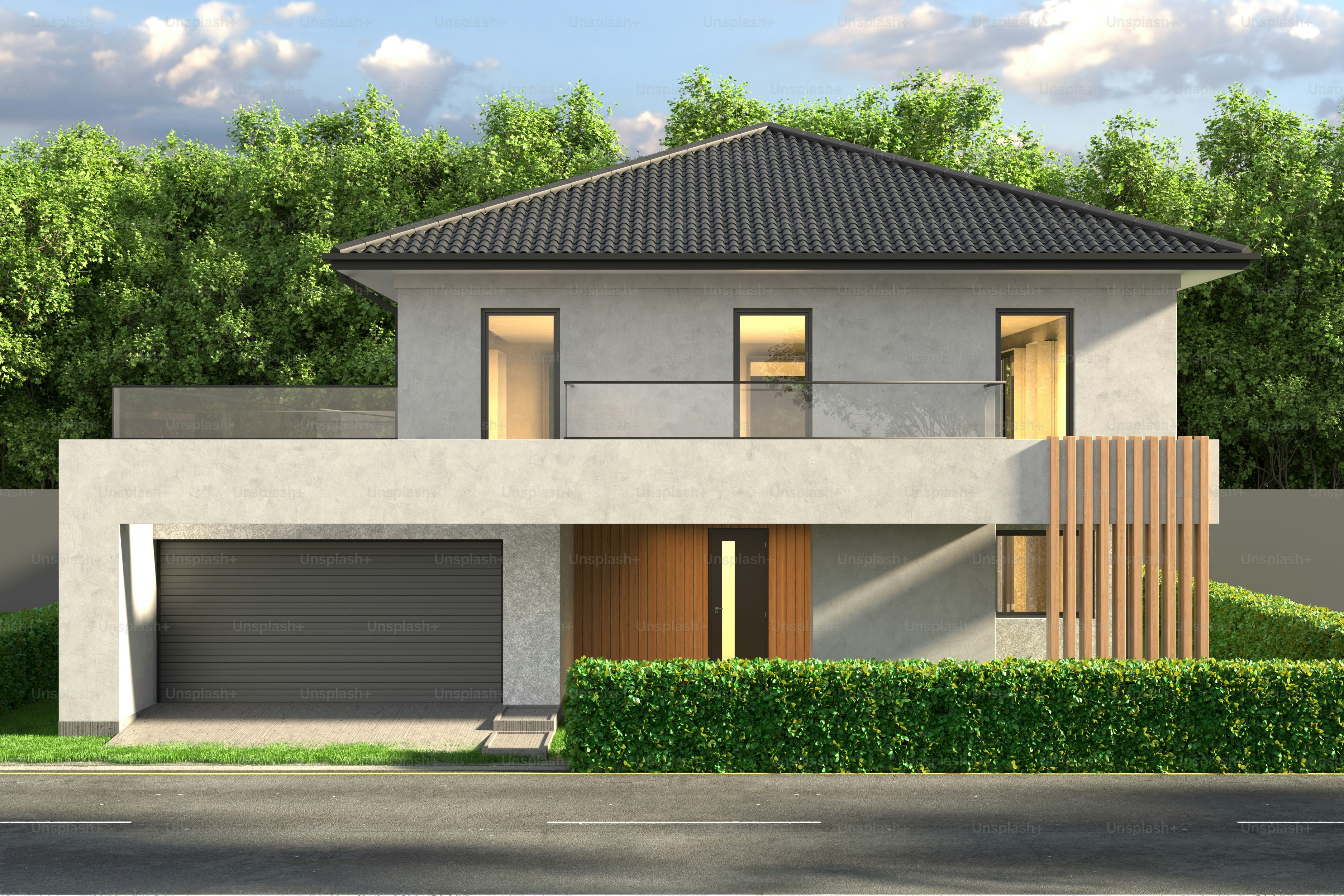 Se muestra una casa moderna con un garaje gris.