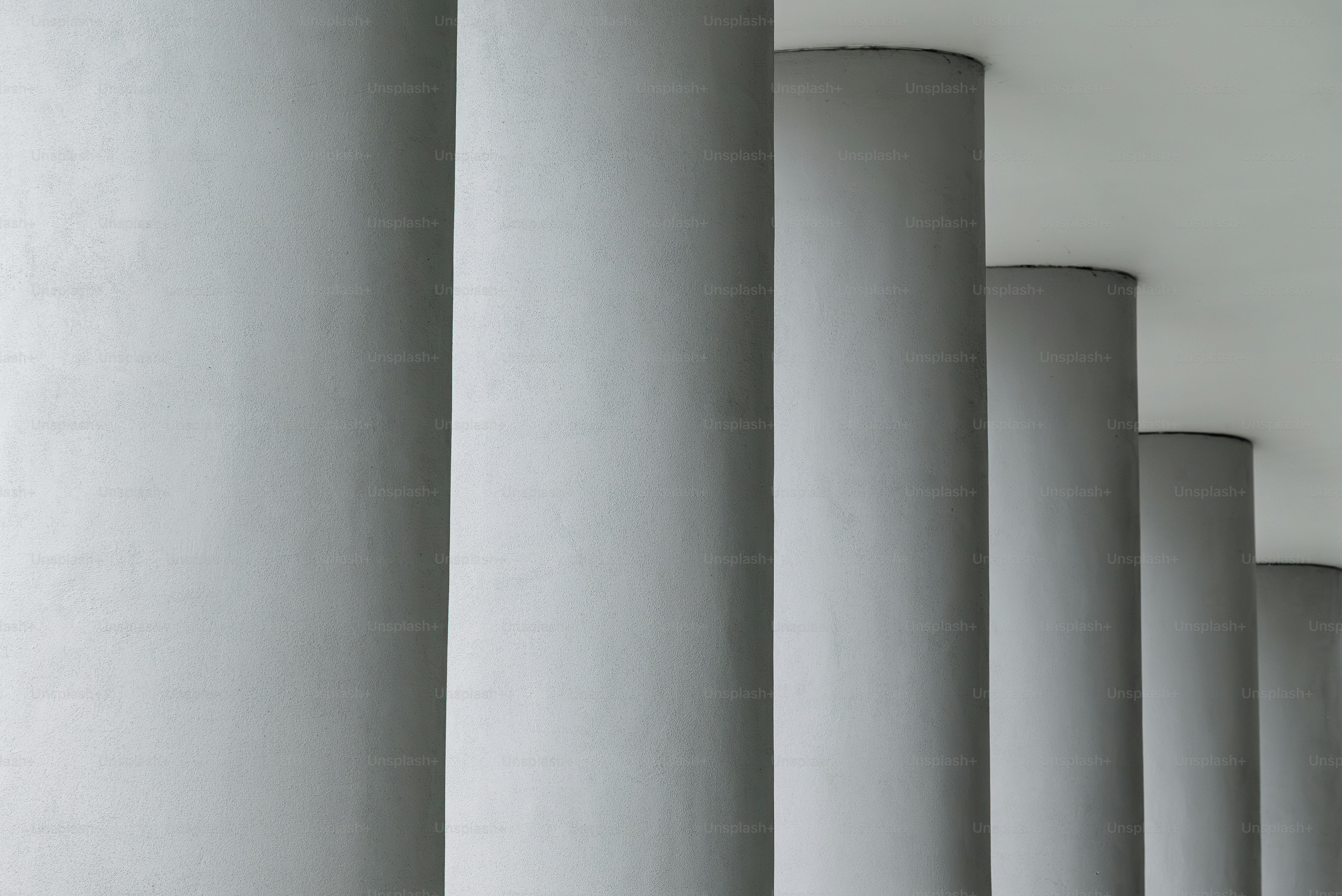 Columns stand in a row on a white background.