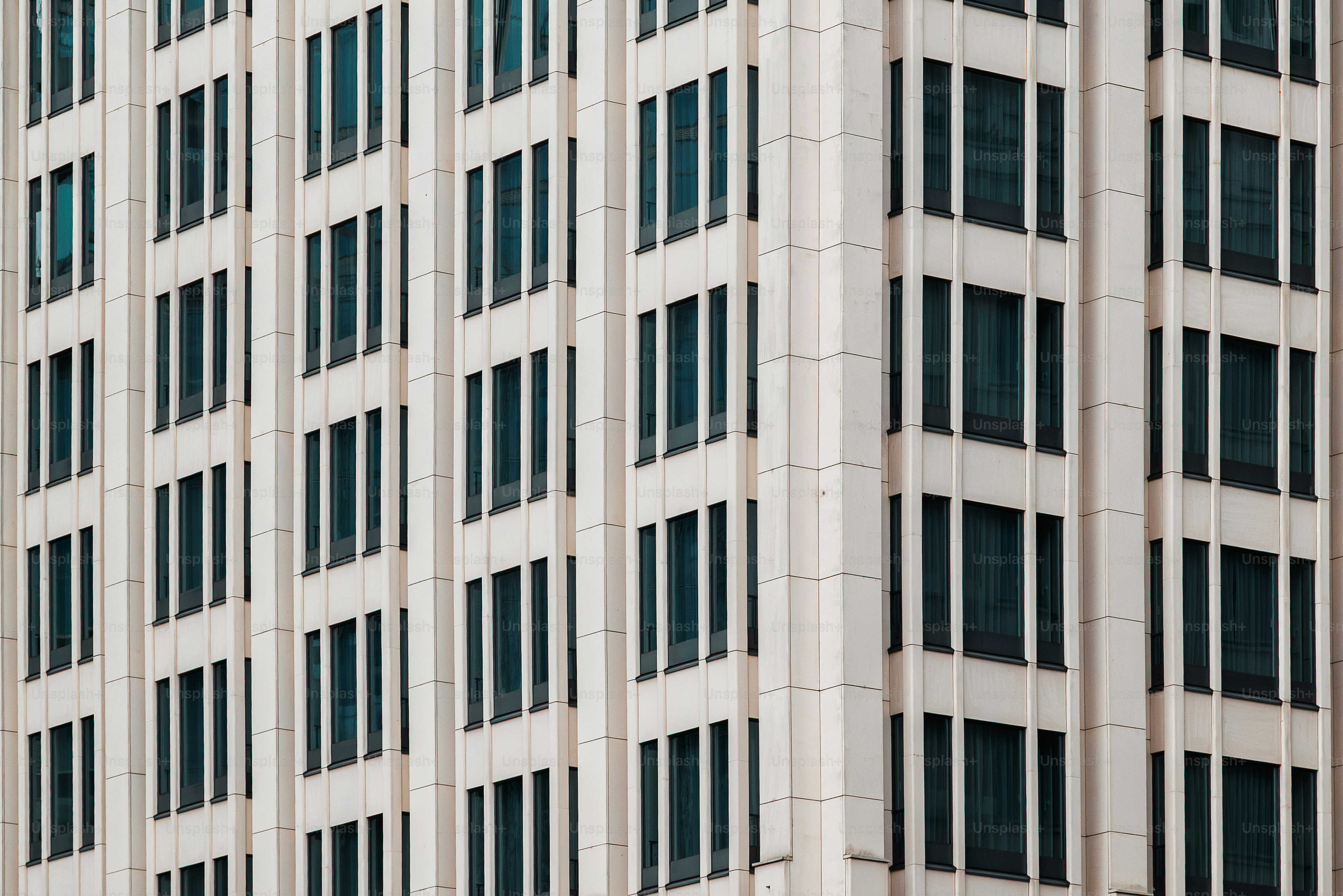 Building facade with many rectangular windows. photo – Architecture ...