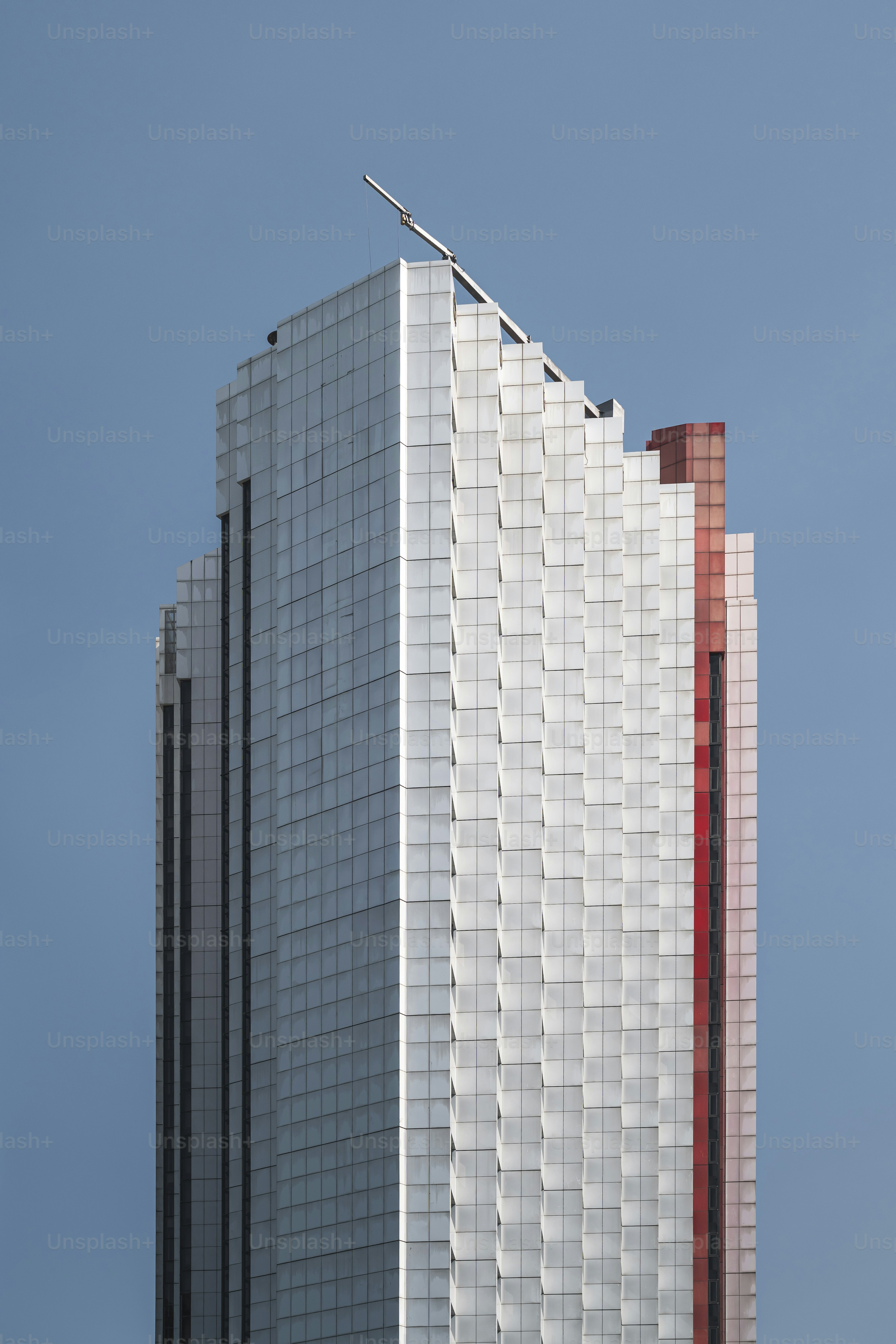 Modern skyscraper with a unique design stands tall.