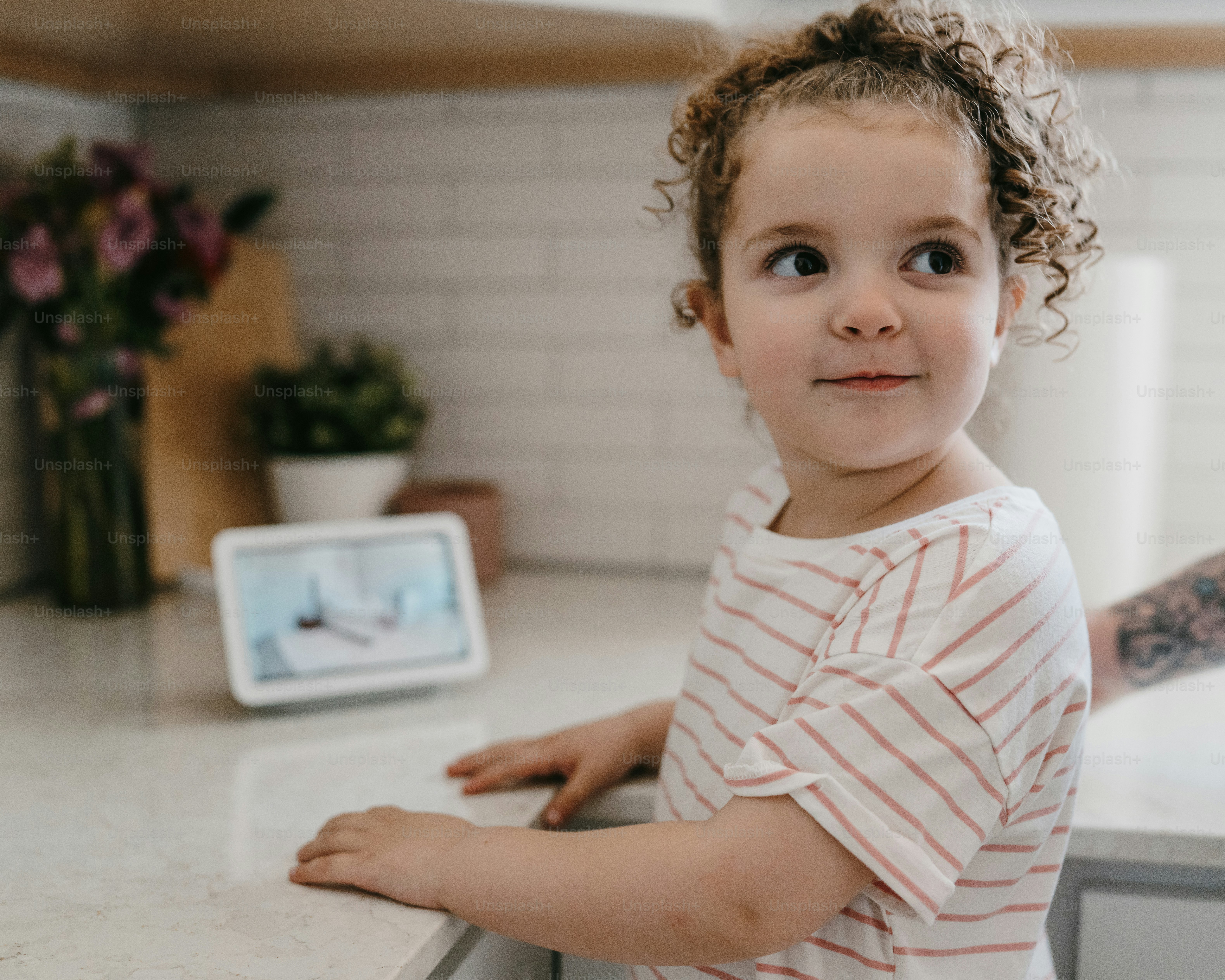 A child gazes at a smart home device.