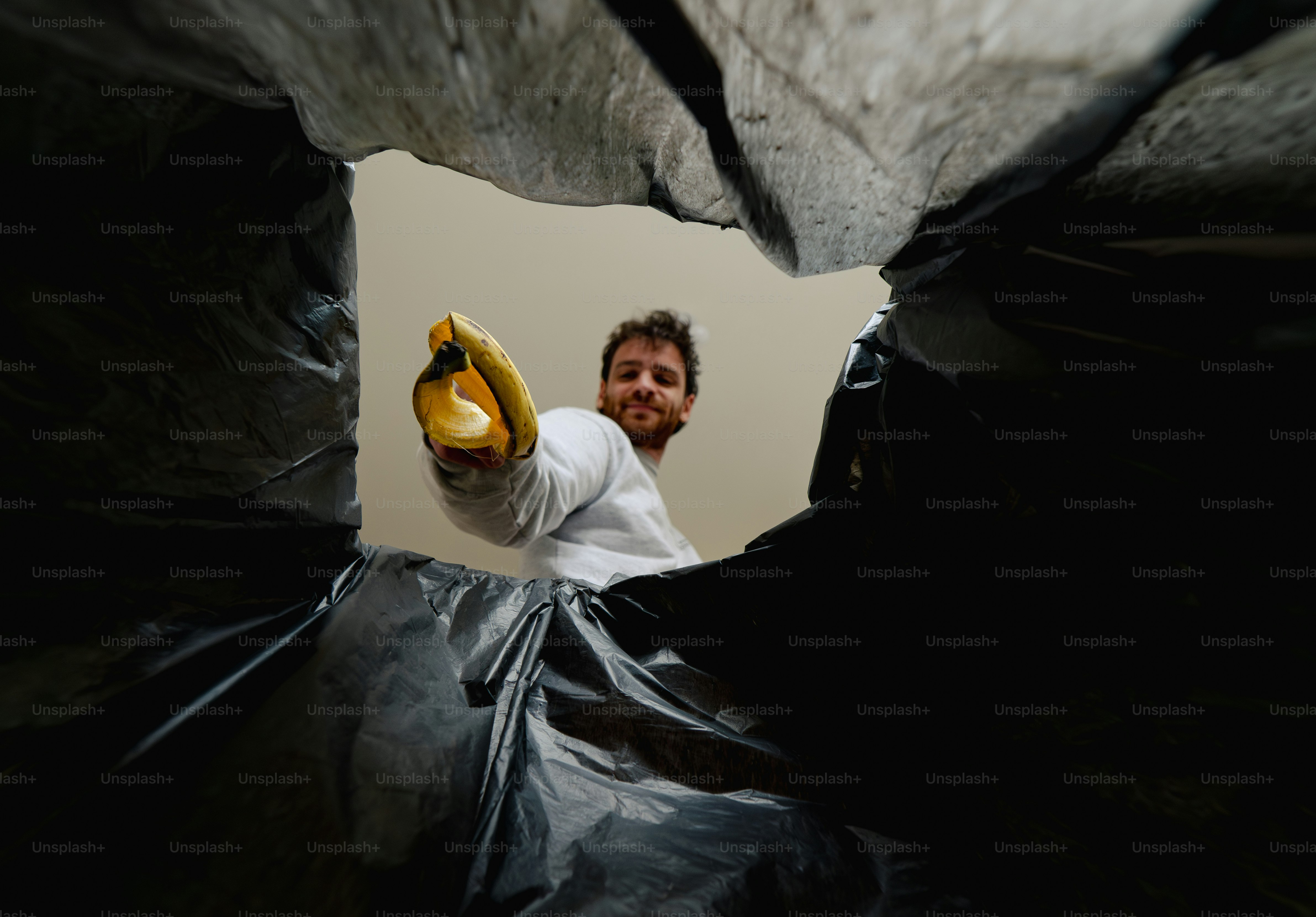 Looking up from inside a trash bag.