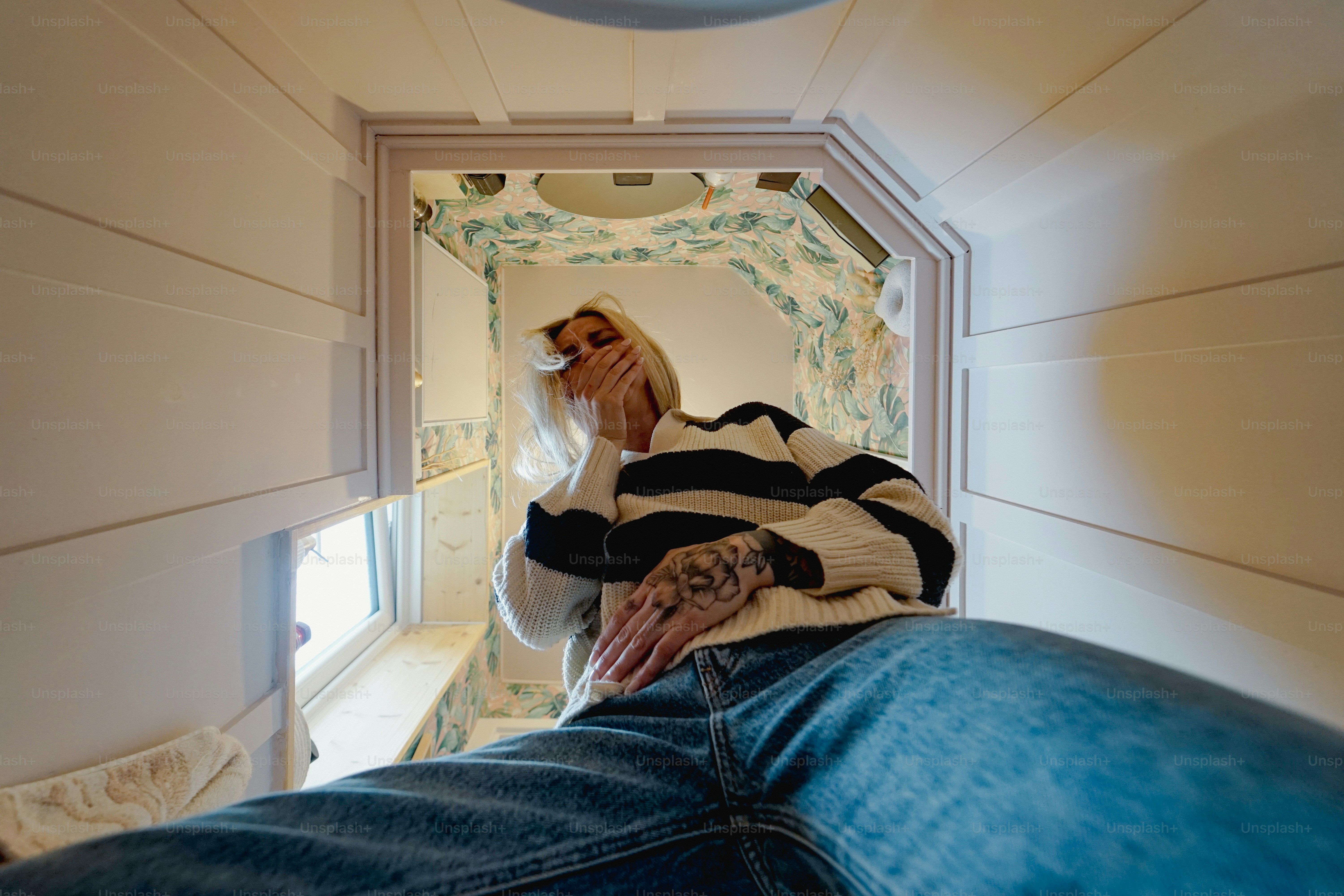 A person sits in a tiny, enclosed space. photo – Aesthetic Image on ...