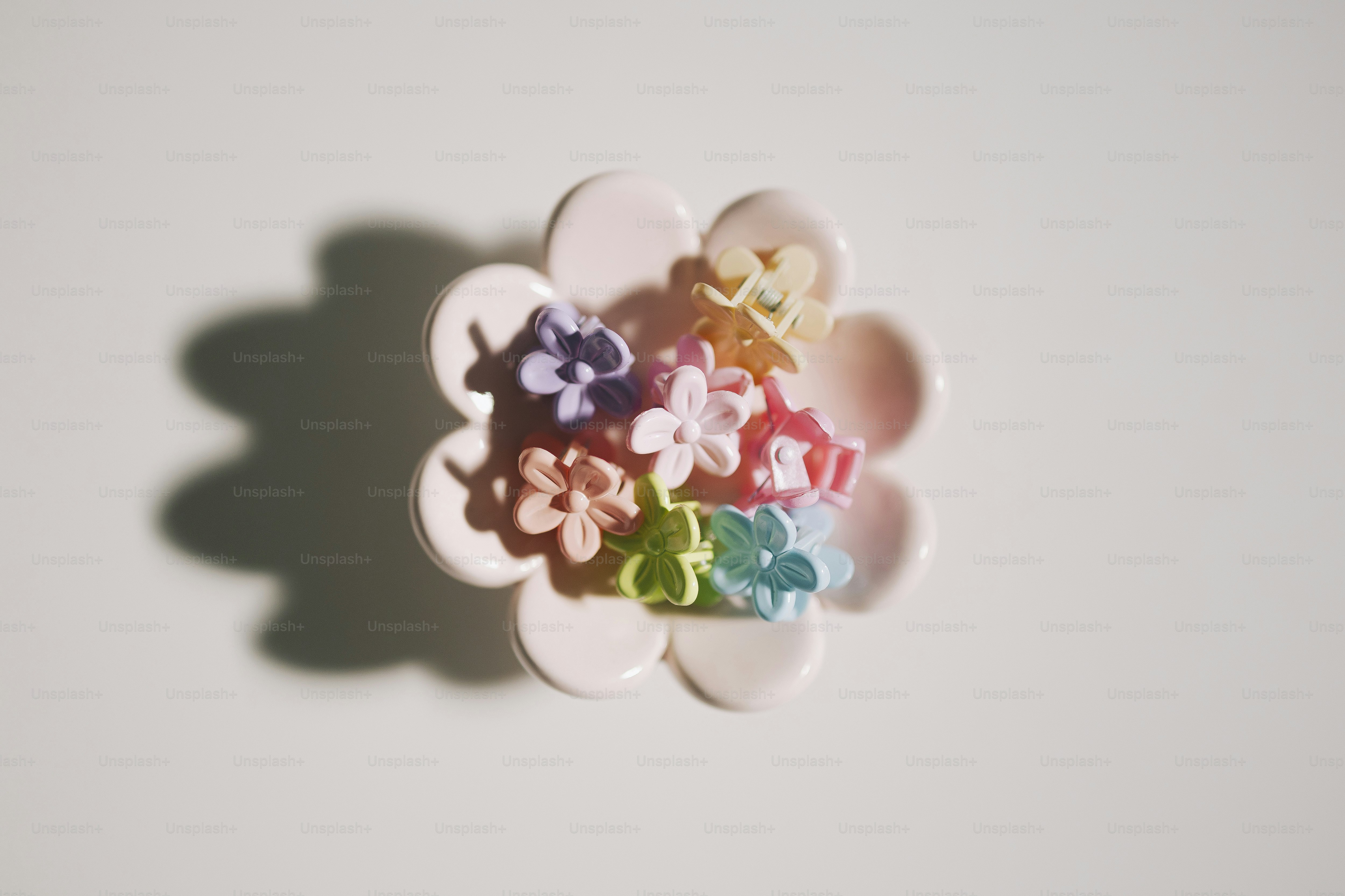 A flower-shaped trinket with colorful blossoms.