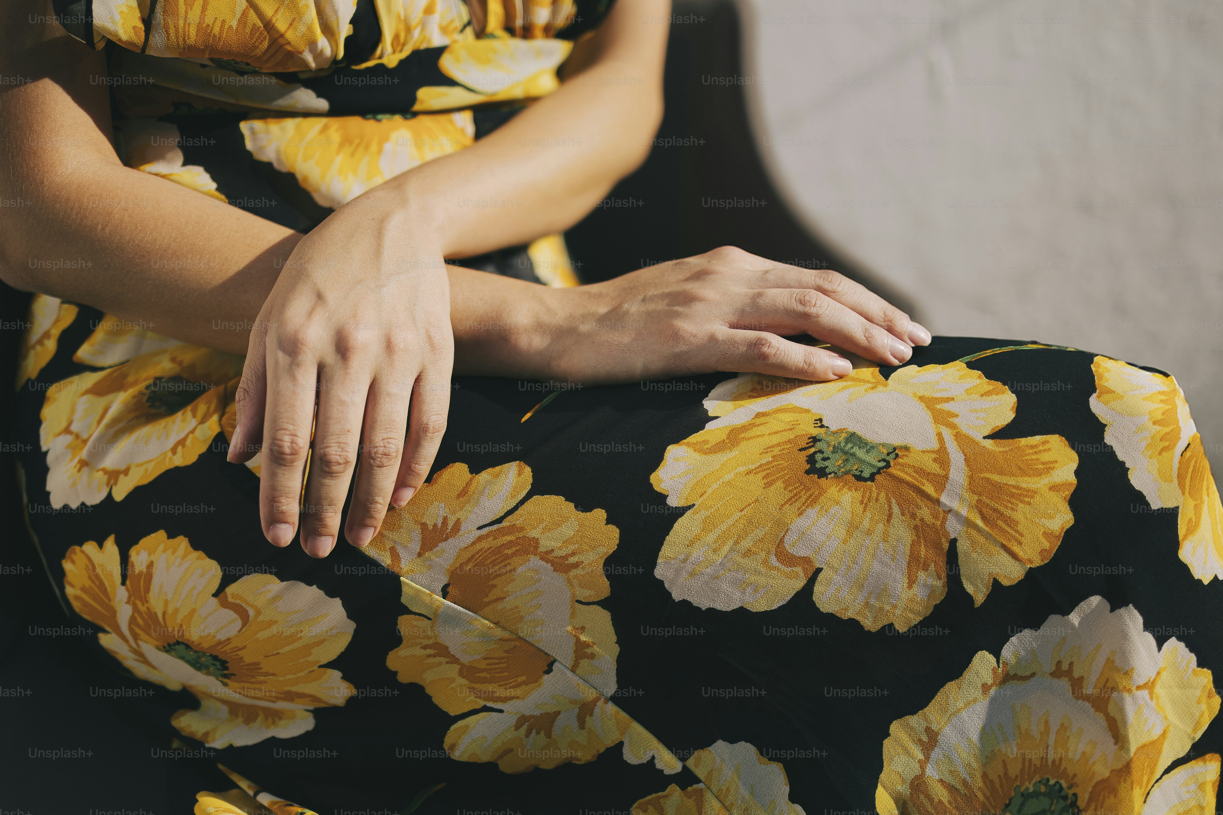 Woman is wearing a floral dress.