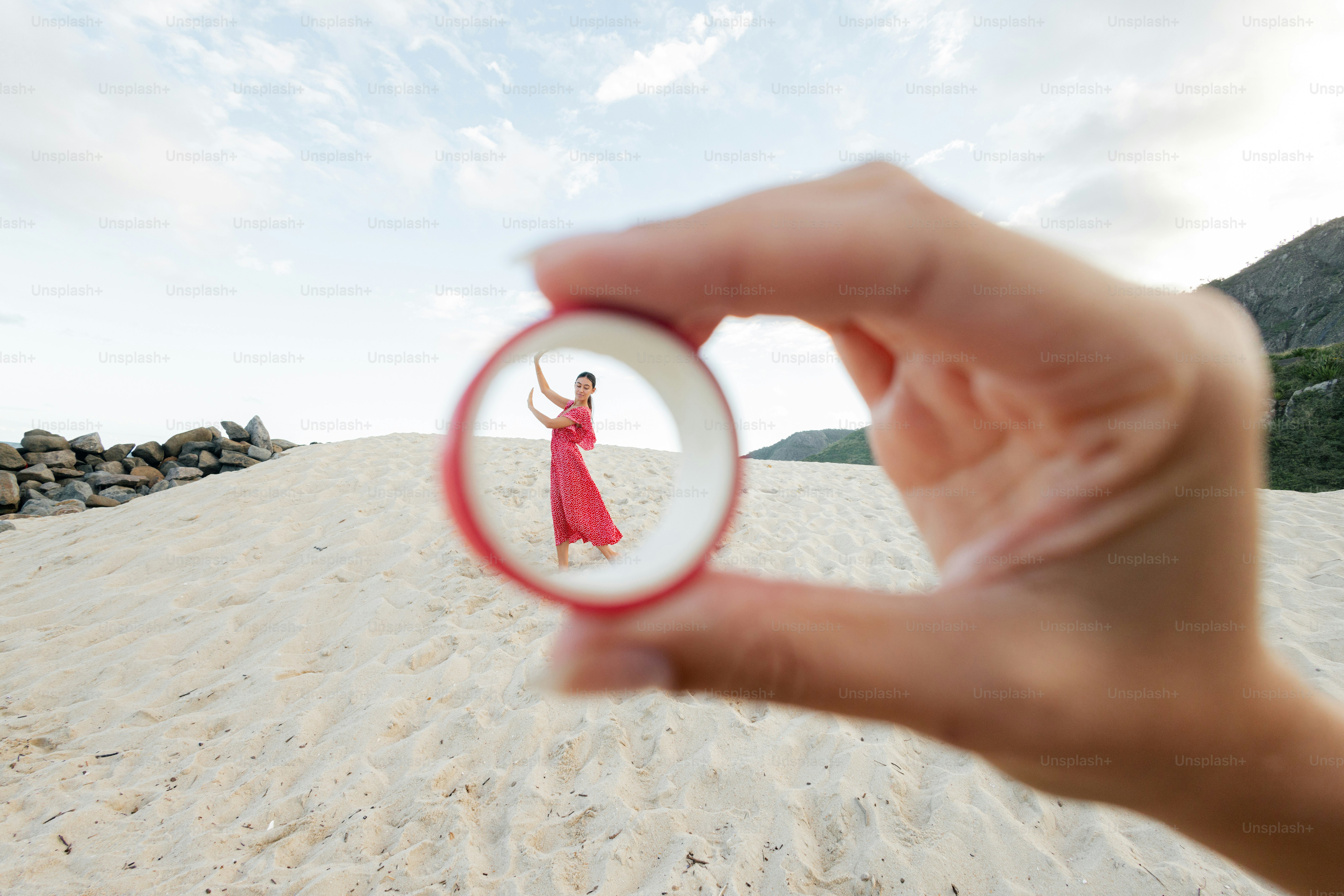 A woman is framed in a circular view.